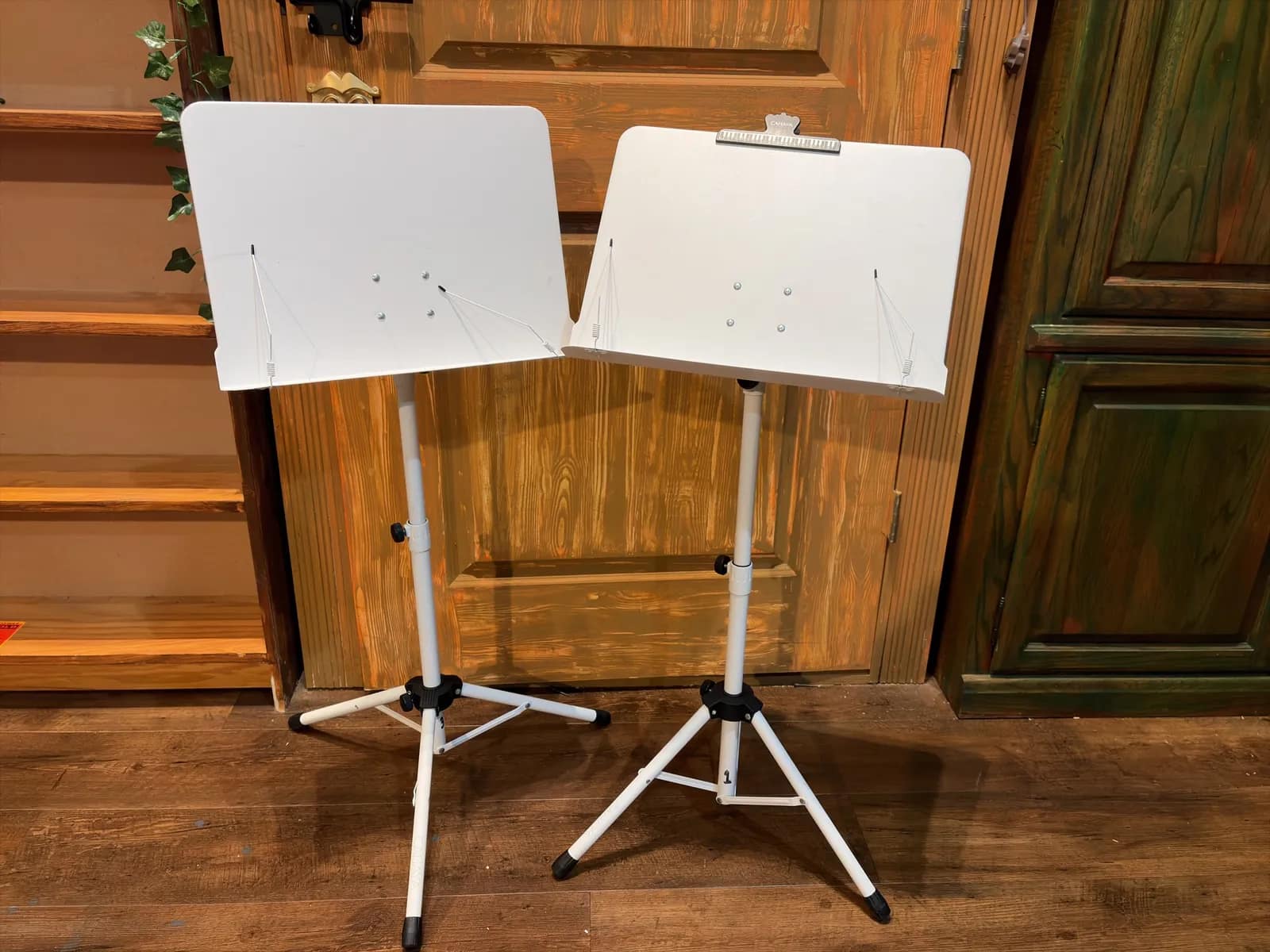 pair-of-white-metal-adjustable-music-stands-df0b08