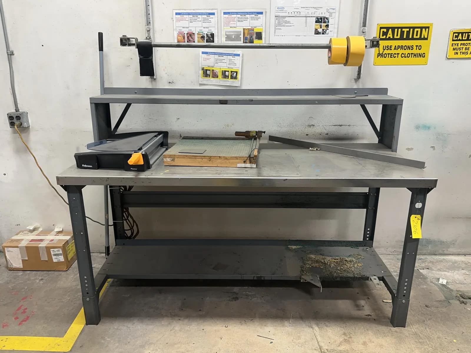 metal-work-table-with-wall-mounted-tape-roll-rack-mrjcsy7g