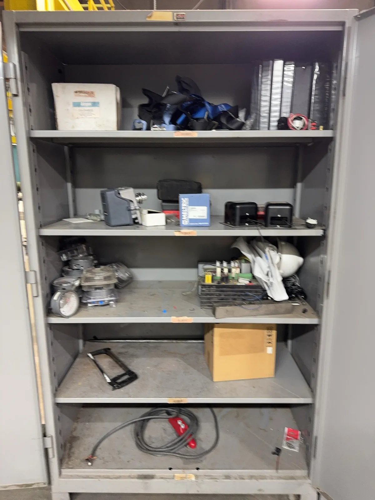 contents-of-cabinet-regulators-safety-harness-saw-and-more-mrdq5gvv