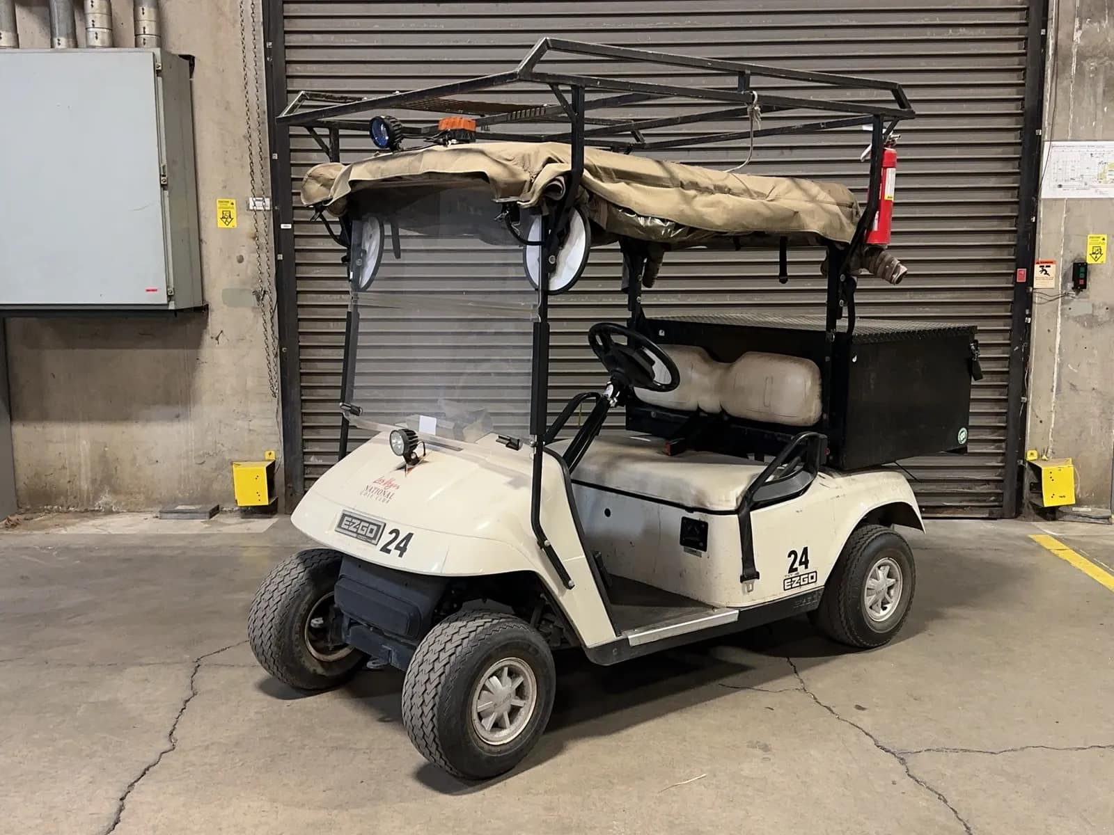ez-go-txt48-electric-golf-cart-with-mounted-storage-box-and-top-rack-3a0d96
