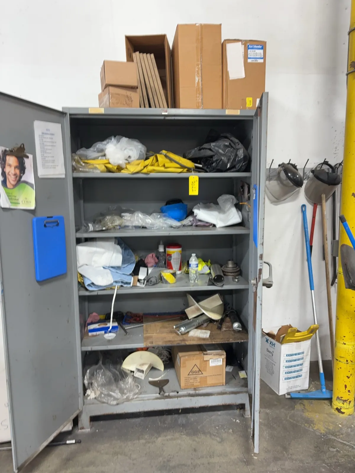 contents-of-cabinet-fiberglass-air-filter-caution-tape-grease-guns-and-more-mrdq5kth