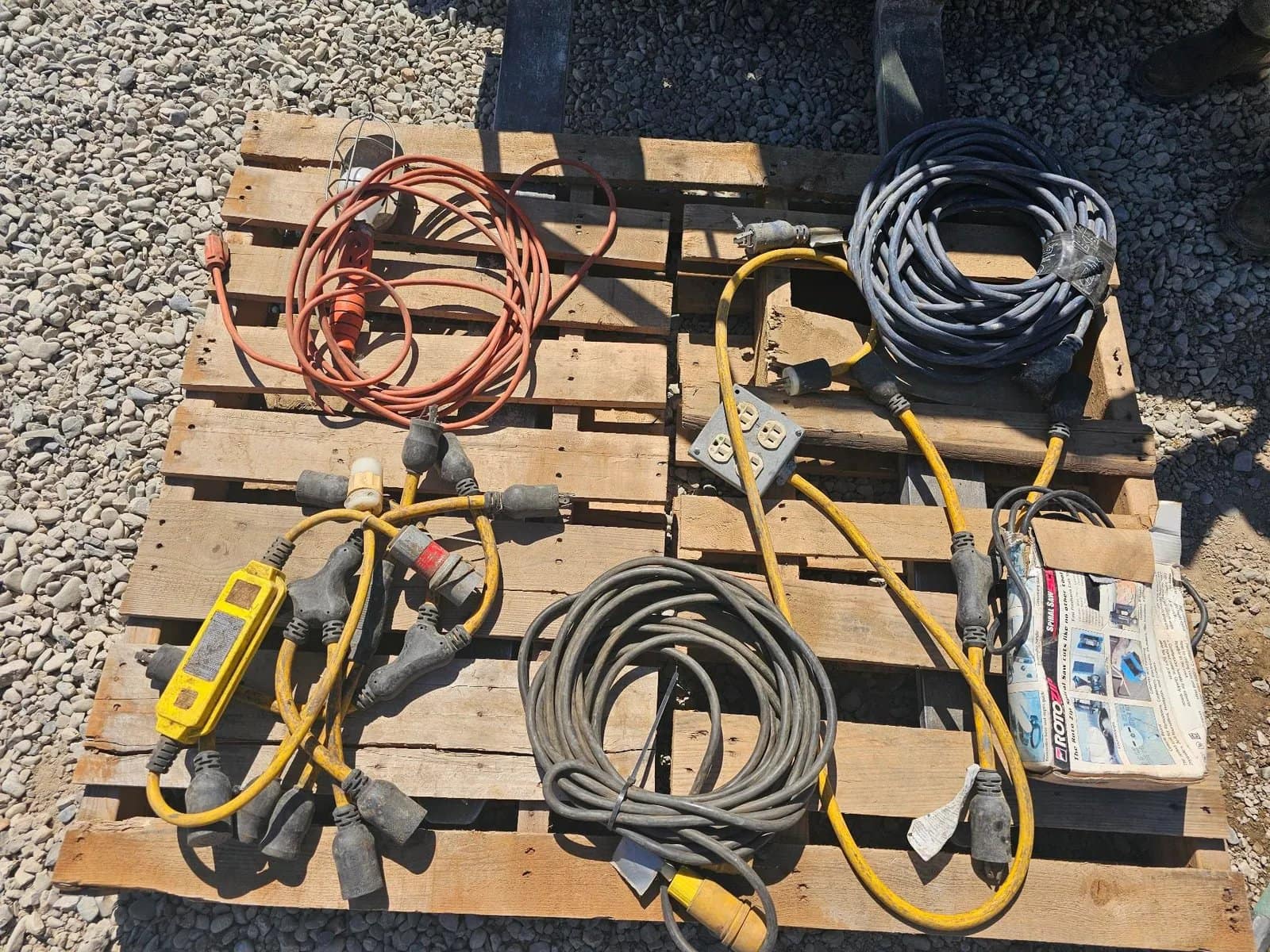 assorted-electrical-cords-and-extension-cables-on-wooden-pallet-65745c
