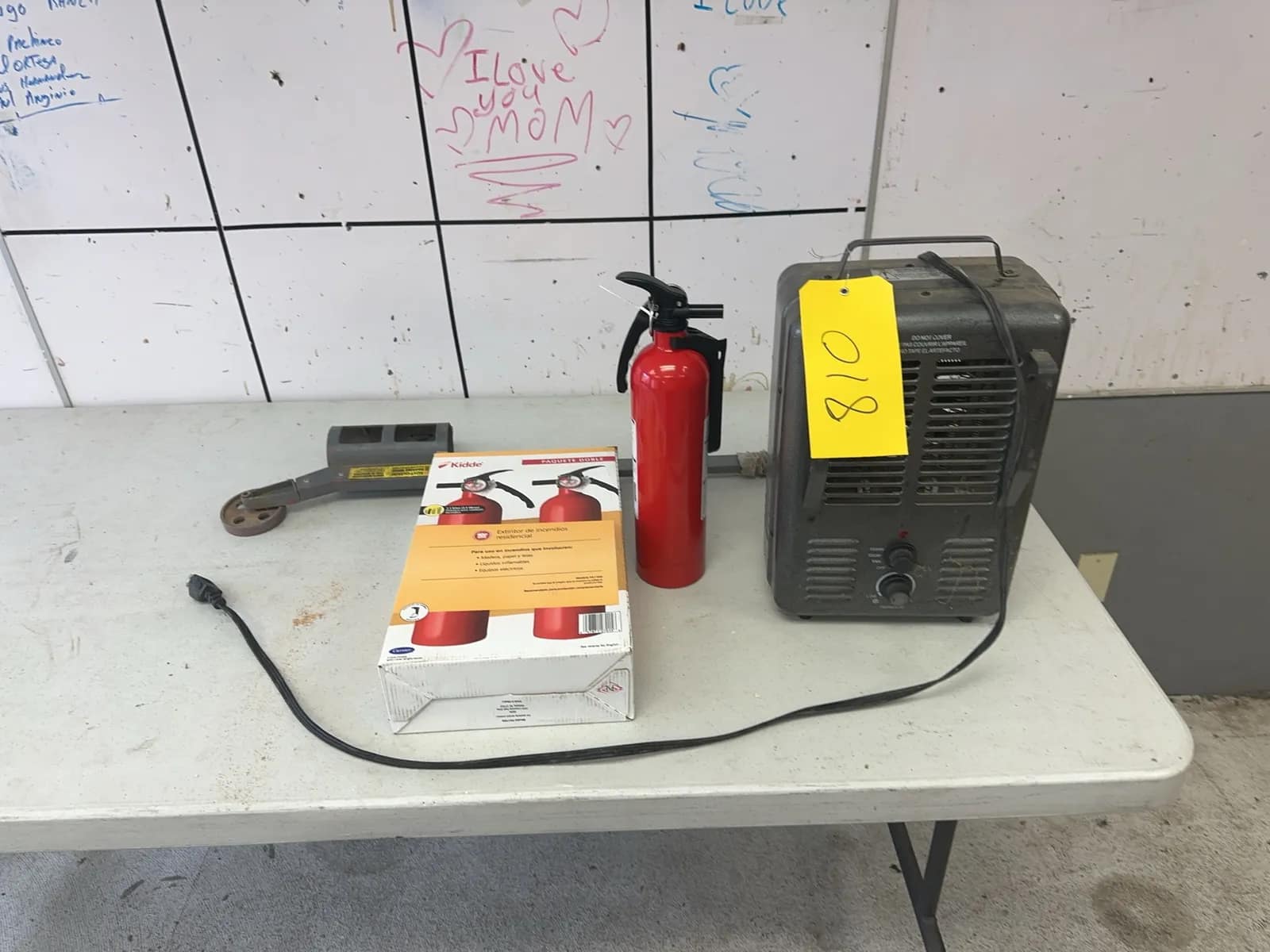 contents-of-table-space-heater-3-fire-extinguishers-and-rust-o-leum-marker-wand-2f4355