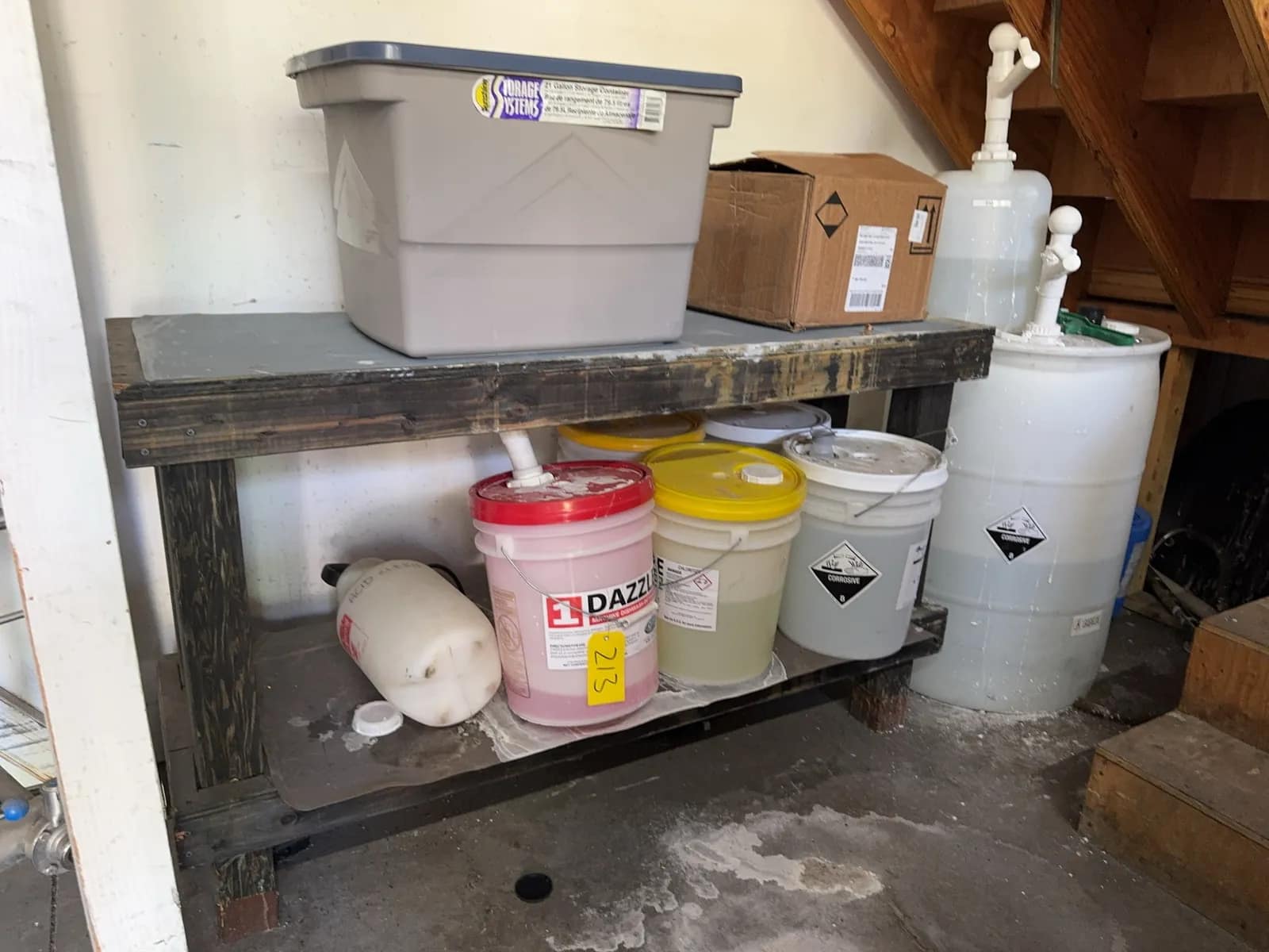 wood-bench-with-assorted-cleaning-chemicals-and-more-b38997