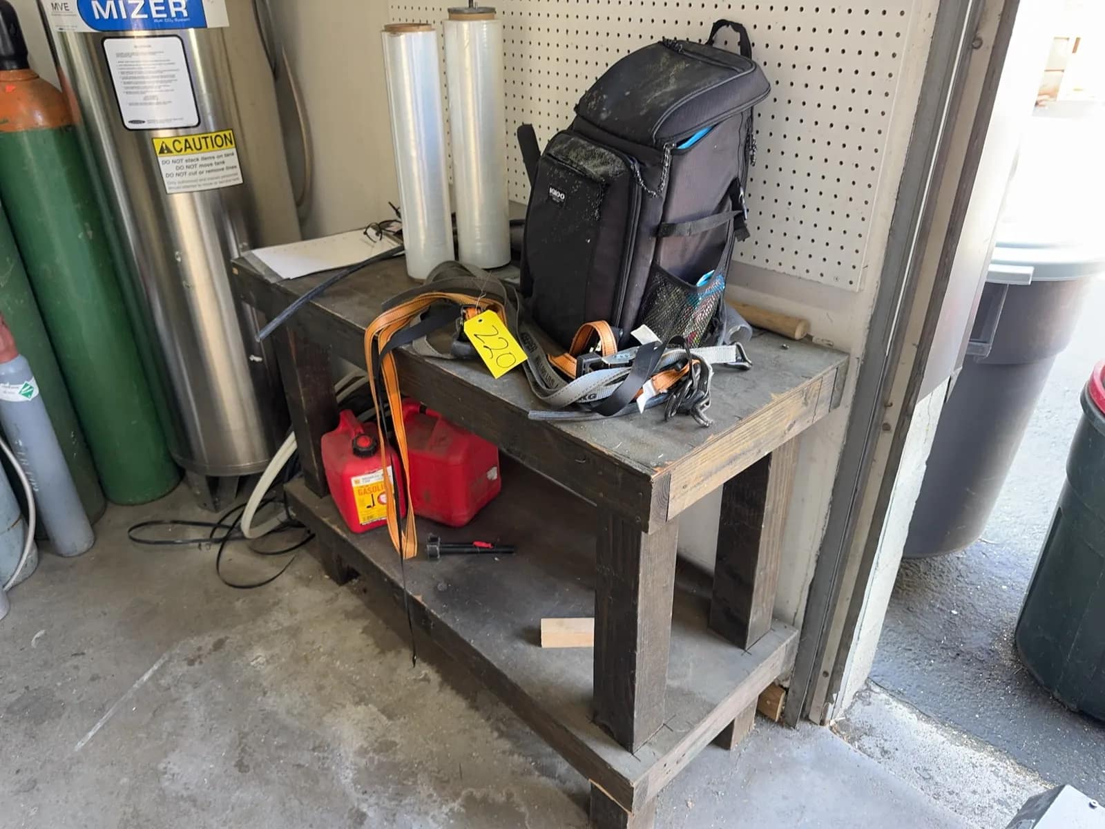 wood-bench-with-contents-gas-cans-igloo-cooler-pack-and-more-57539c