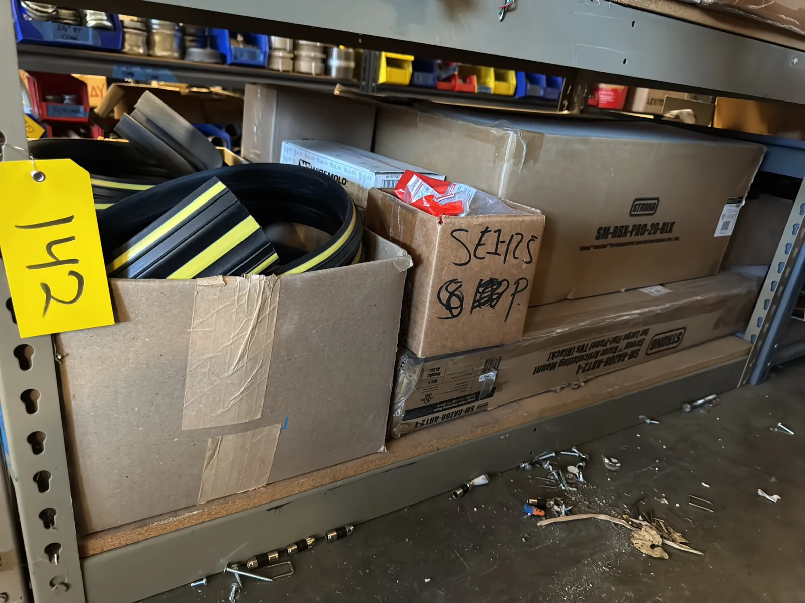 Contents Of (1) Shelf: Assorted Electrical Supply, Floor Cable Cover, HDTV Mounting Accessories And More, photo 1 of 7