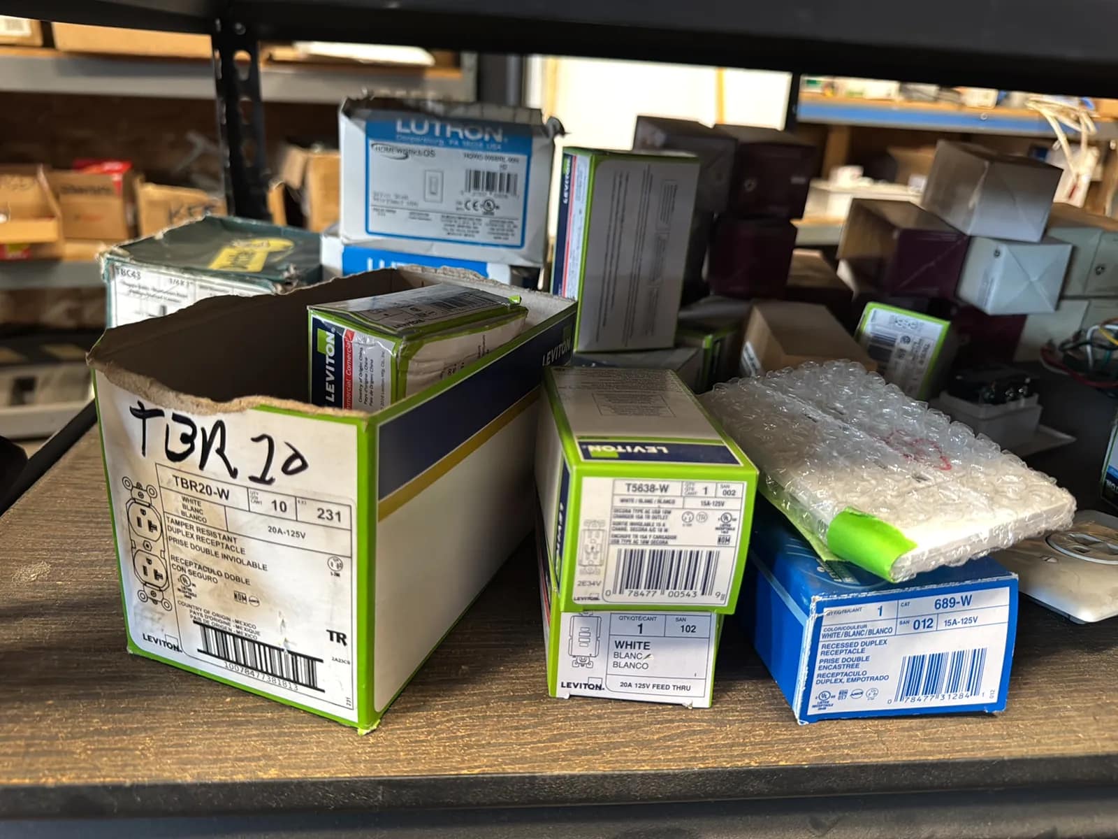 Contents Of (1) Shelf: Leviton Switches , Lutron Switches, Assorted Hardware And Mote, photo 2 of 11