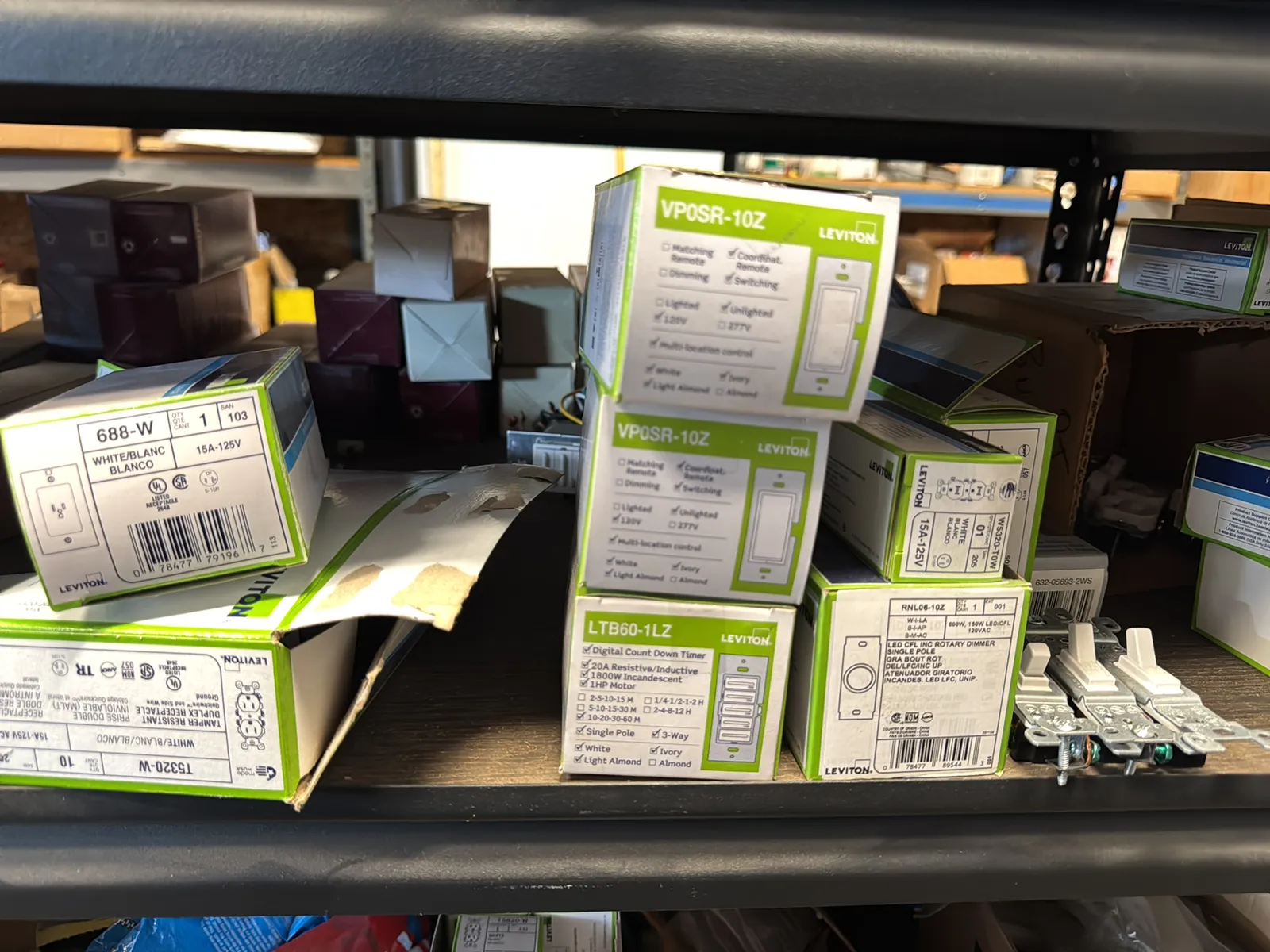 Contents Of (1) Shelf: Leviton Switches , Lutron Switches, Assorted Hardware And Mote, photo 4 of 11