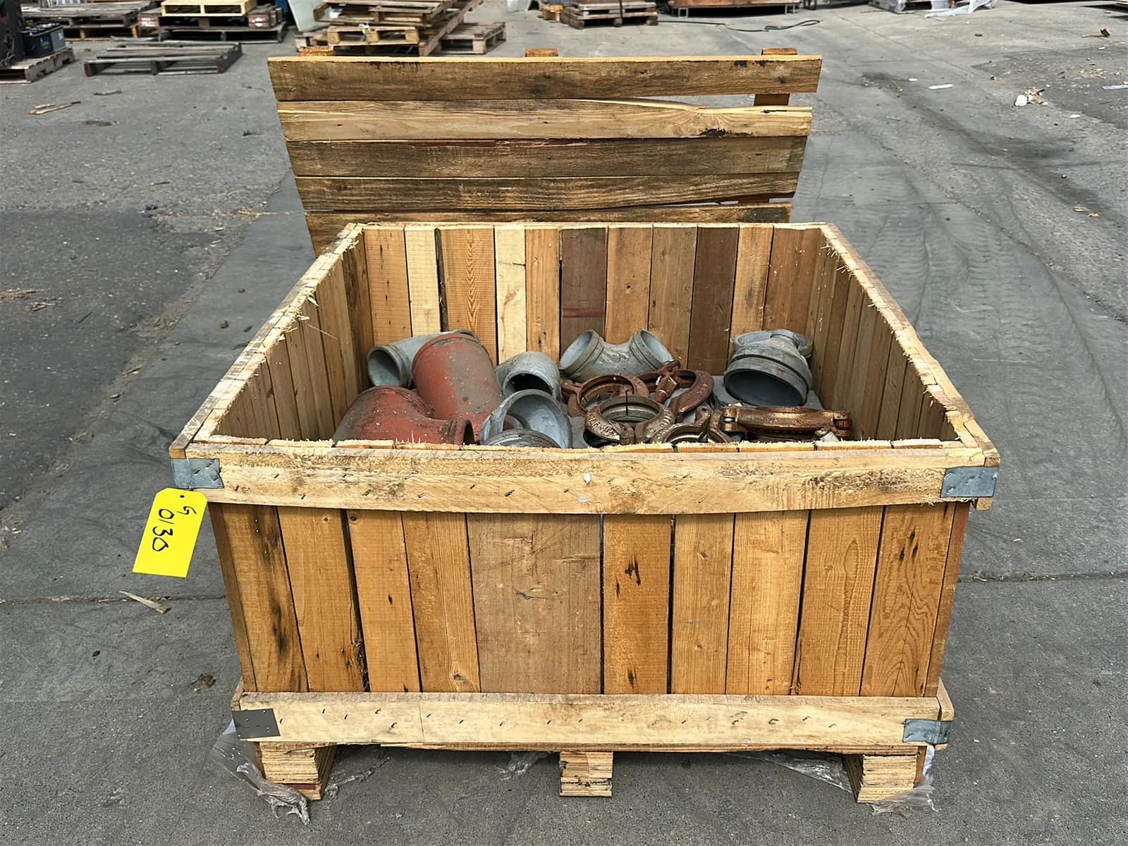 Crate and Contents: Assorted Pipe Clamps, Steel Elbows, Steel Couplers, And More, photo 1 of 6