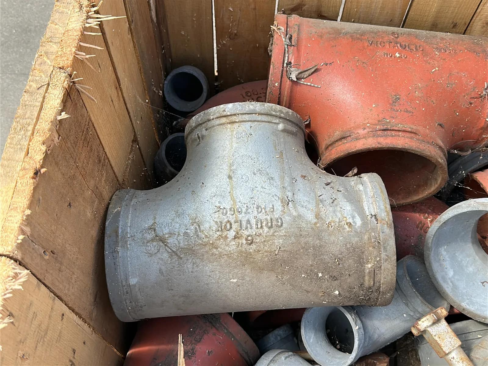Crate and Contents: Assorted Pipe Clamps, Steel Elbows, Steel Couplers, And More, photo 4 of 6