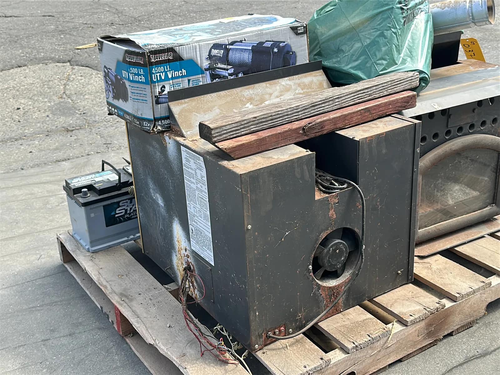 Contents Of Pallet: (2) Wood Burning Furnaces, Traveller 4,500Lb UTV Winch, (2) Car Batteries, And More, photo 9 of 10