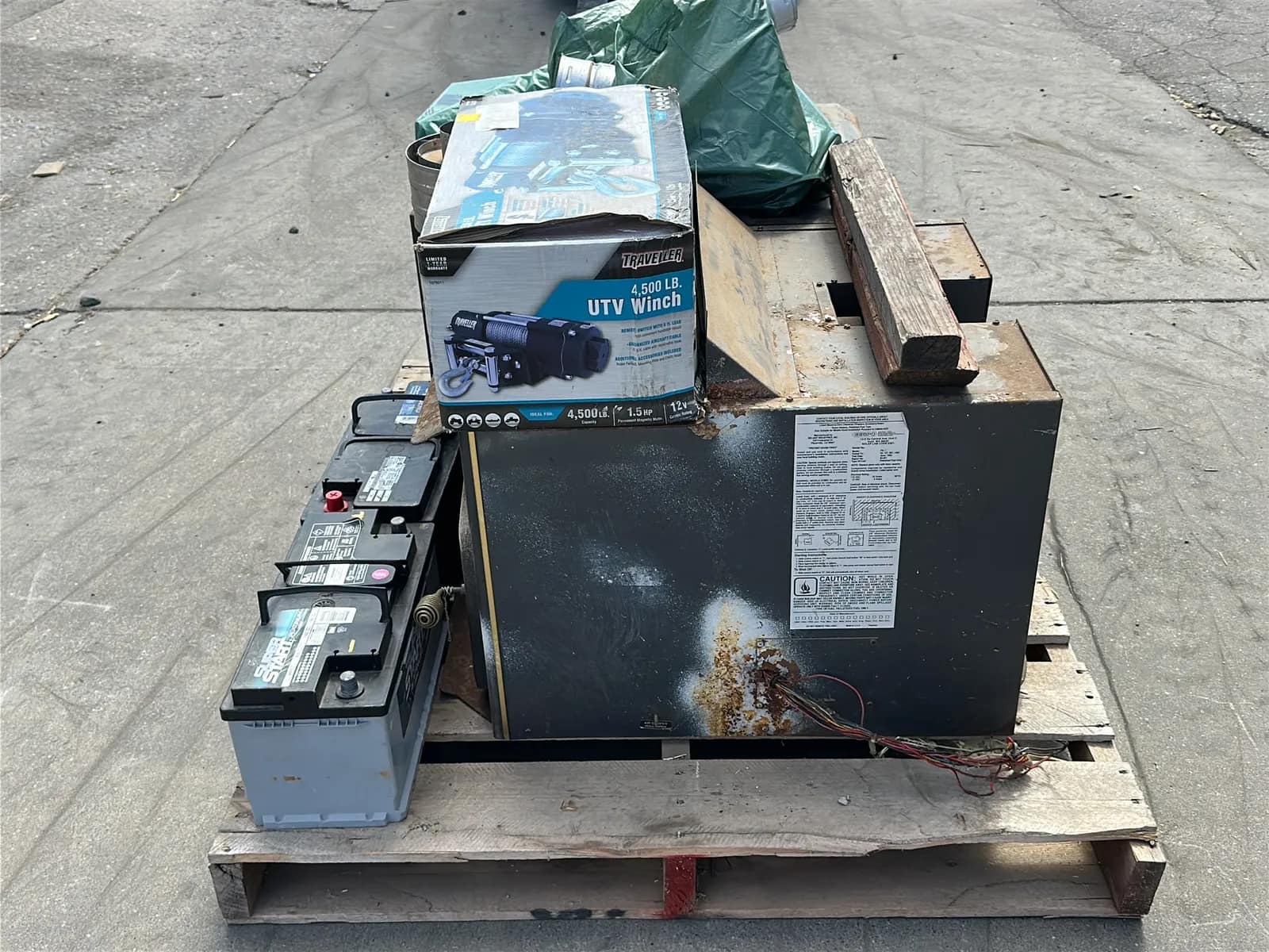Contents Of Pallet: (2) Wood Burning Furnaces, Traveller 4,500Lb UTV Winch, (2) Car Batteries, And More, photo 8 of 10