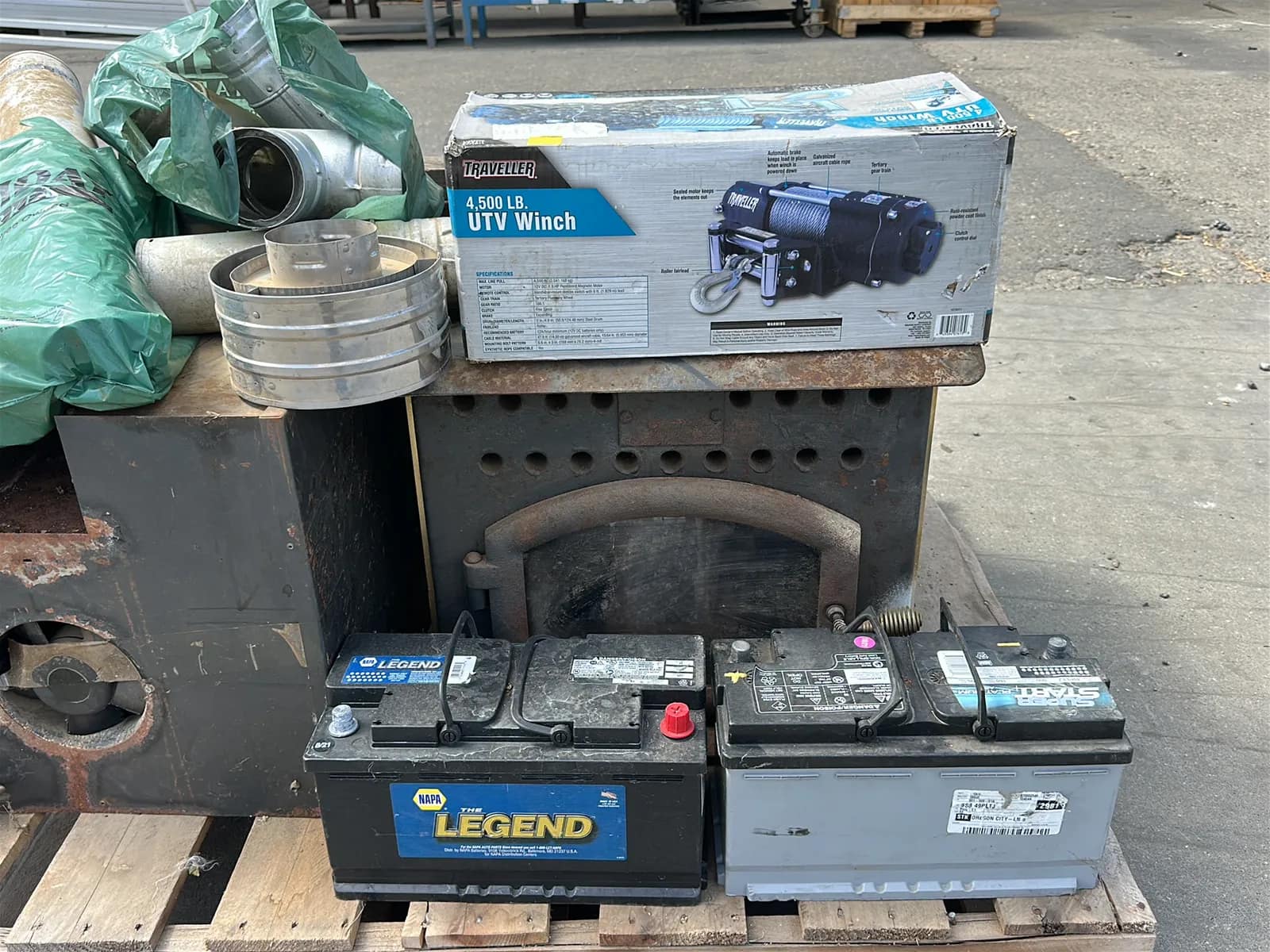 Contents Of Pallet: (2) Wood Burning Furnaces, Traveller 4,500Lb UTV Winch, (2) Car Batteries, And More, photo 7 of 10