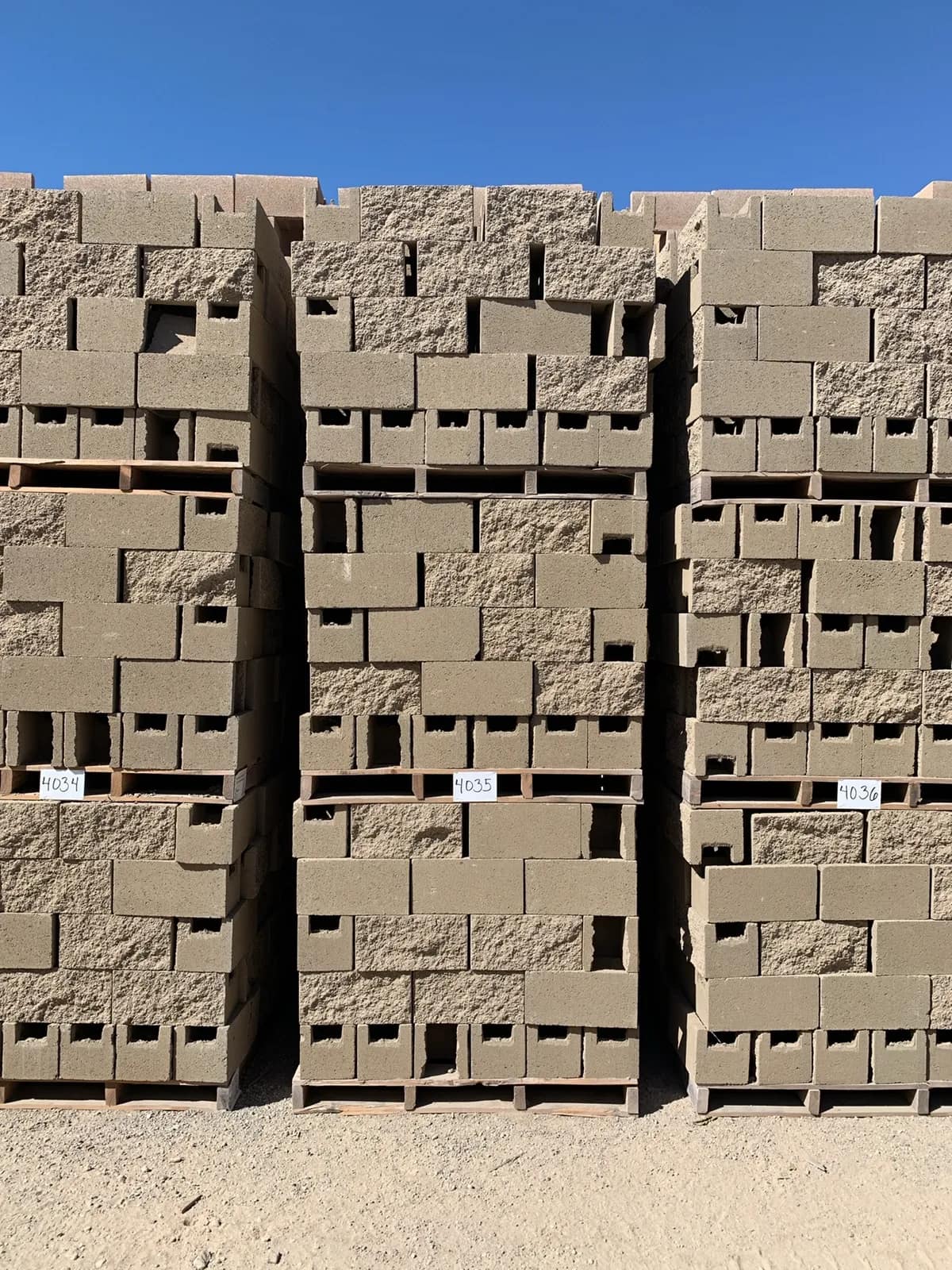 3-pallets-8x8x16-split-one-side-open-end-bond-beam-tan-f9cb00