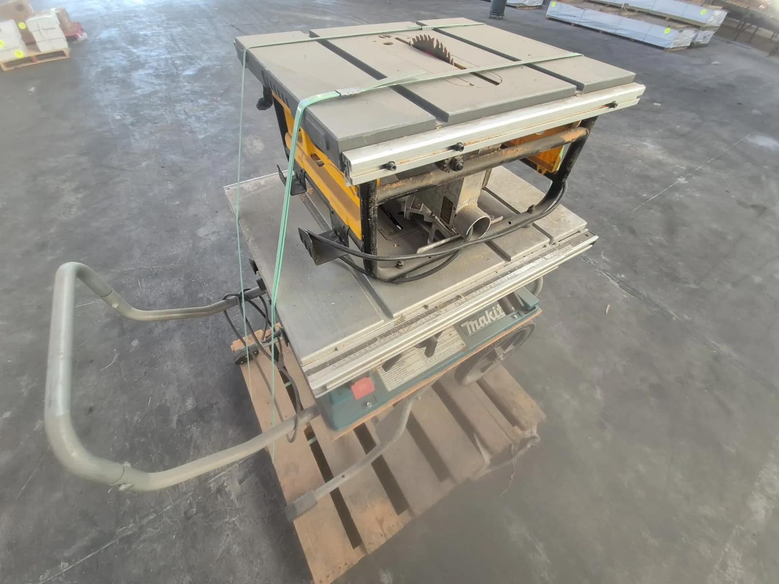 Contents Of Pallet: (1) DeWalt 10-inch Corded Table Saw, (1) Makita 10-inch Portable Table Saw, photo 2 of 9