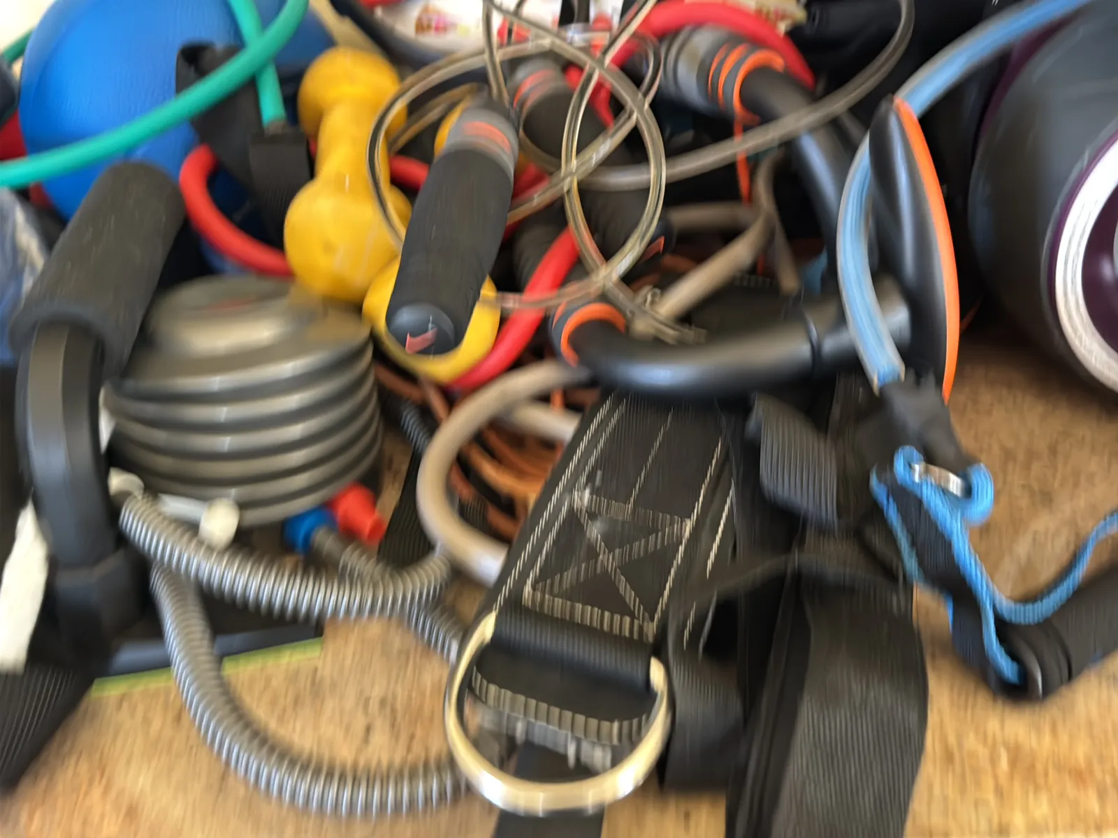 Contents Of Countertop: Kettlebells, Rubber Bands, Peloton Accessories, Yoga Mats, Pilates Equipment, And Machine Parts, photo 18 of 19
