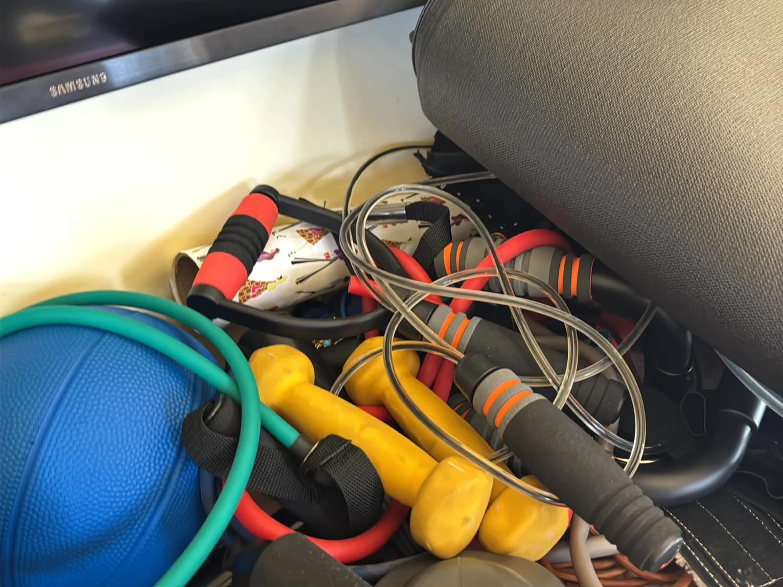 Contents Of Countertop: Kettlebells, Rubber Bands, Peloton Accessories, Yoga Mats, Pilates Equipment, And Machine Parts, photo 10 of 19