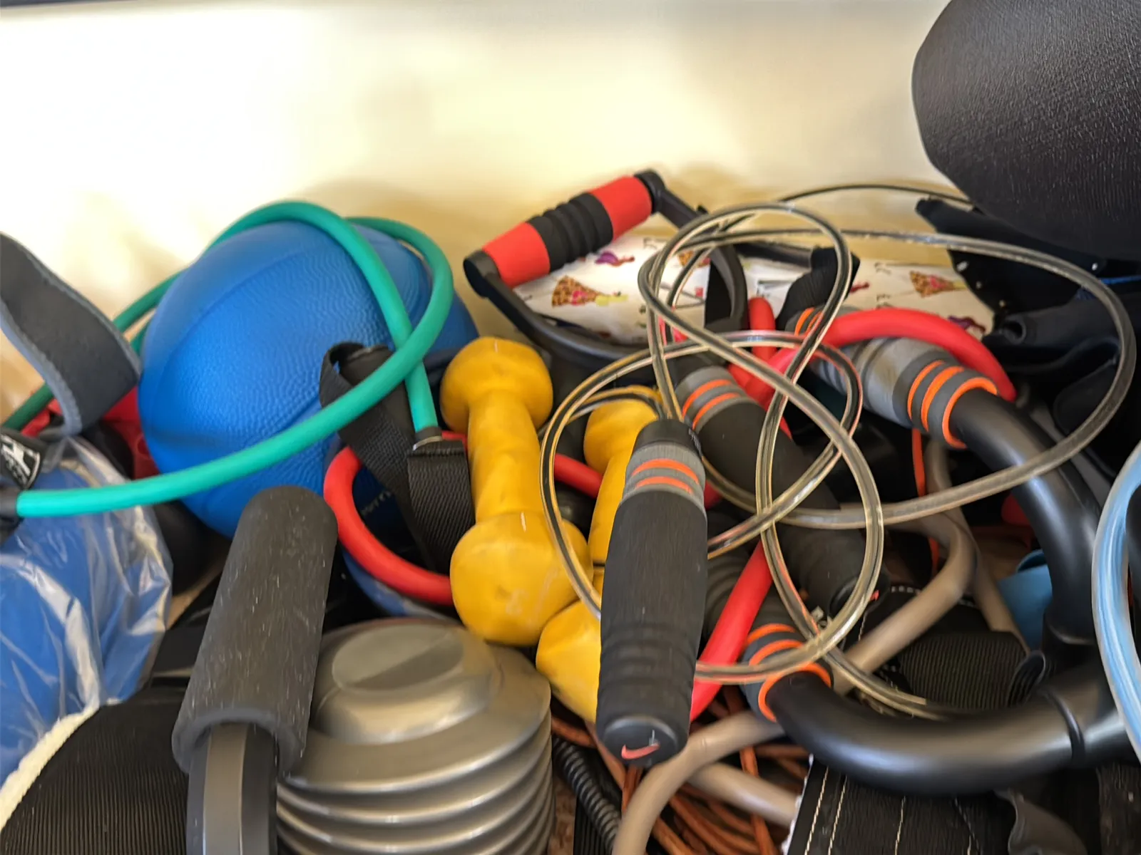 Contents Of Countertop: Kettlebells, Rubber Bands, Peloton Accessories, Yoga Mats, Pilates Equipment, And Machine Parts, photo 19 of 19