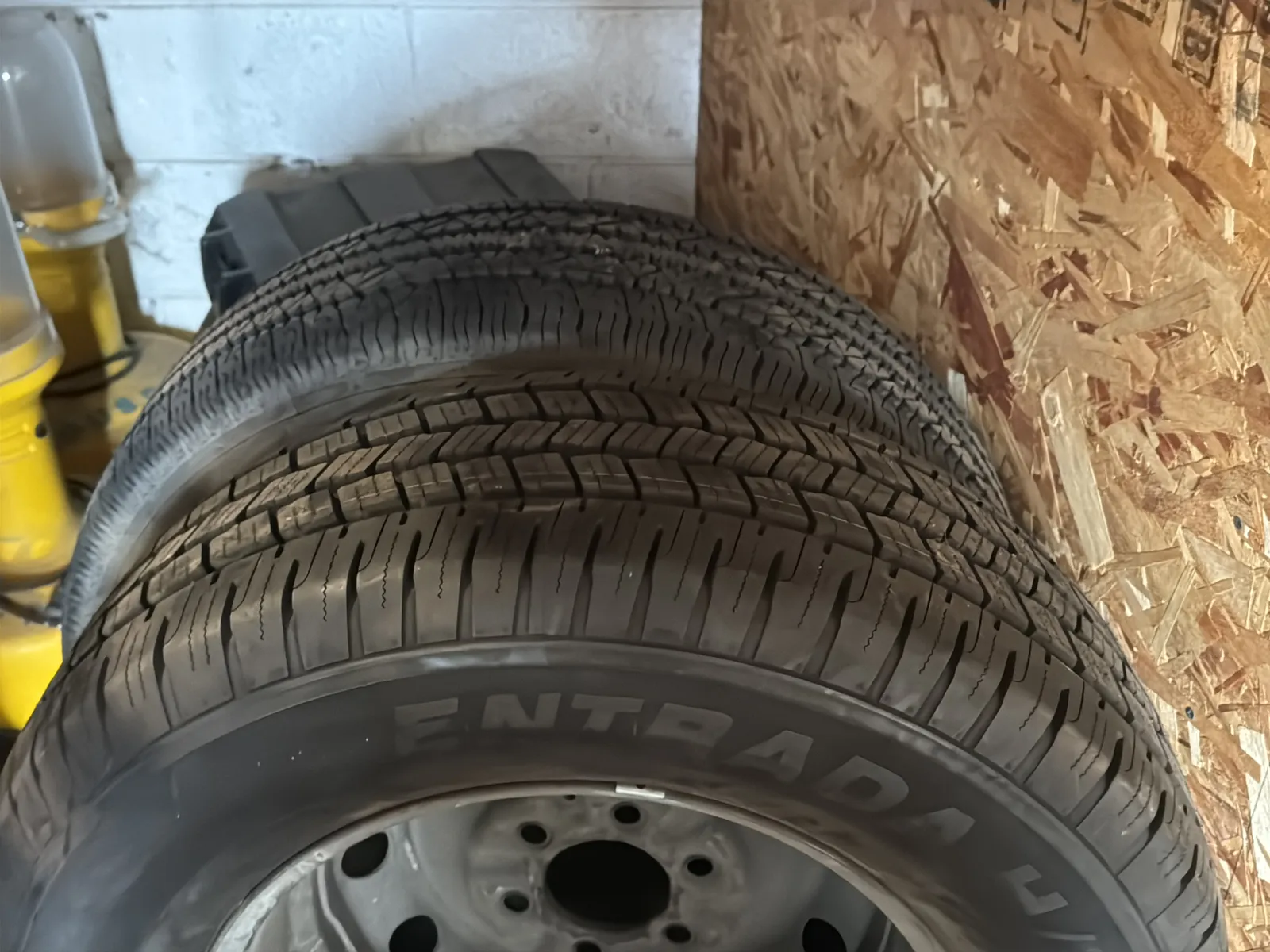 Contents Under Staircase: (2) Tires, Rolling Toolbox, Job-site Light Extension Cords, And Bricks., photo 7 of 15