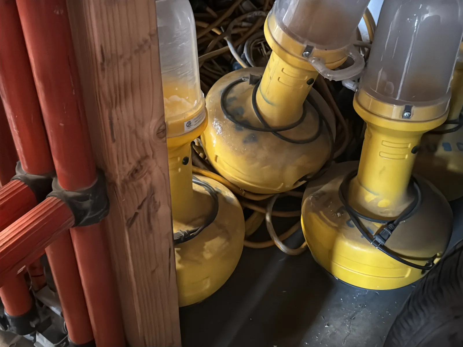 Contents Under Staircase: (2) Tires, Rolling Toolbox, Job-site Light Extension Cords, And Bricks., photo 11 of 15