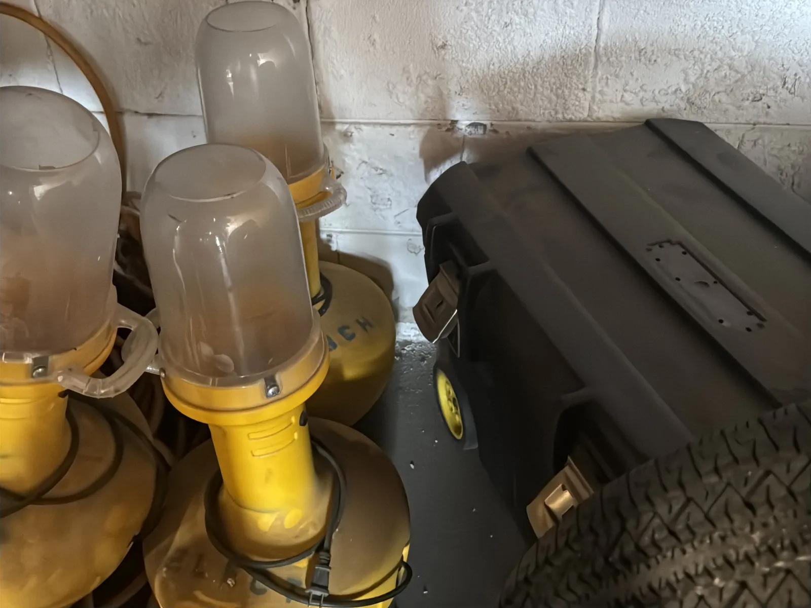 Contents Under Staircase: (2) Tires, Rolling Toolbox, Job-site Light Extension Cords, And Bricks., photo 8 of 15