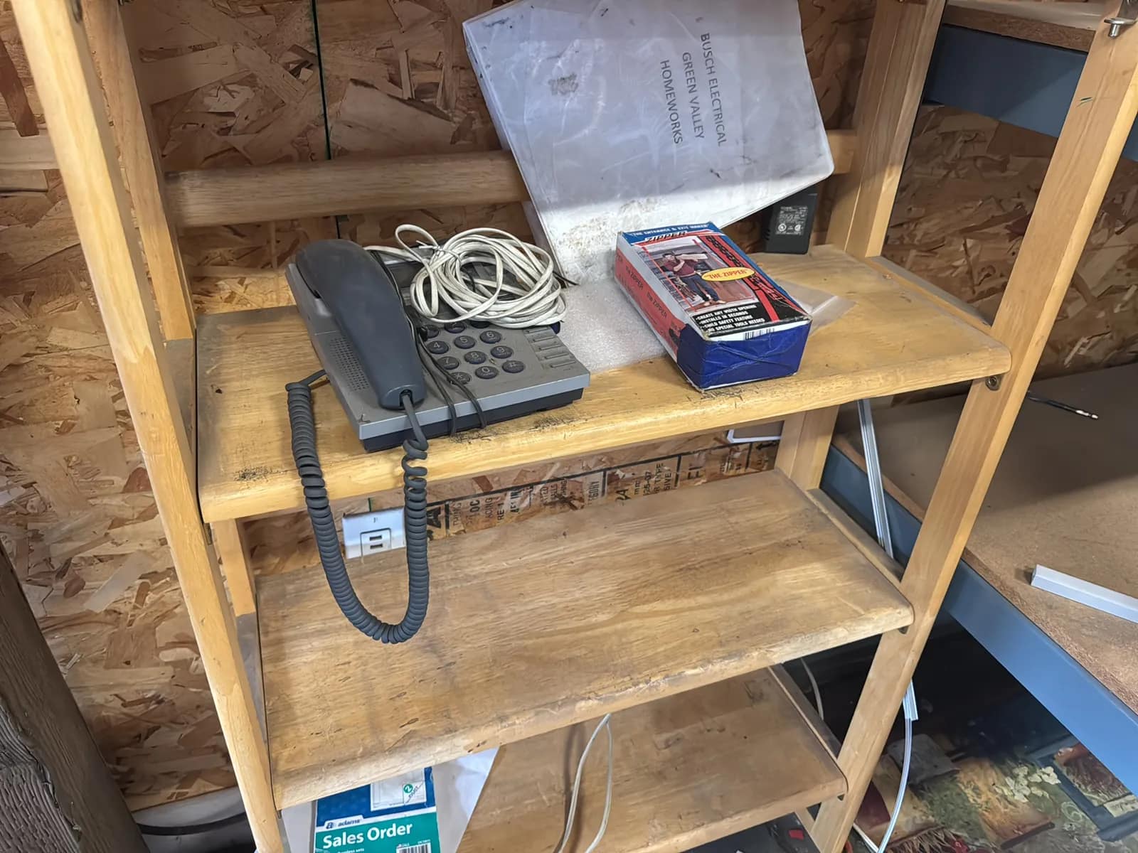 Bookshelf And Contents: Phone, And Entrance Zipper, photo 3 of 8