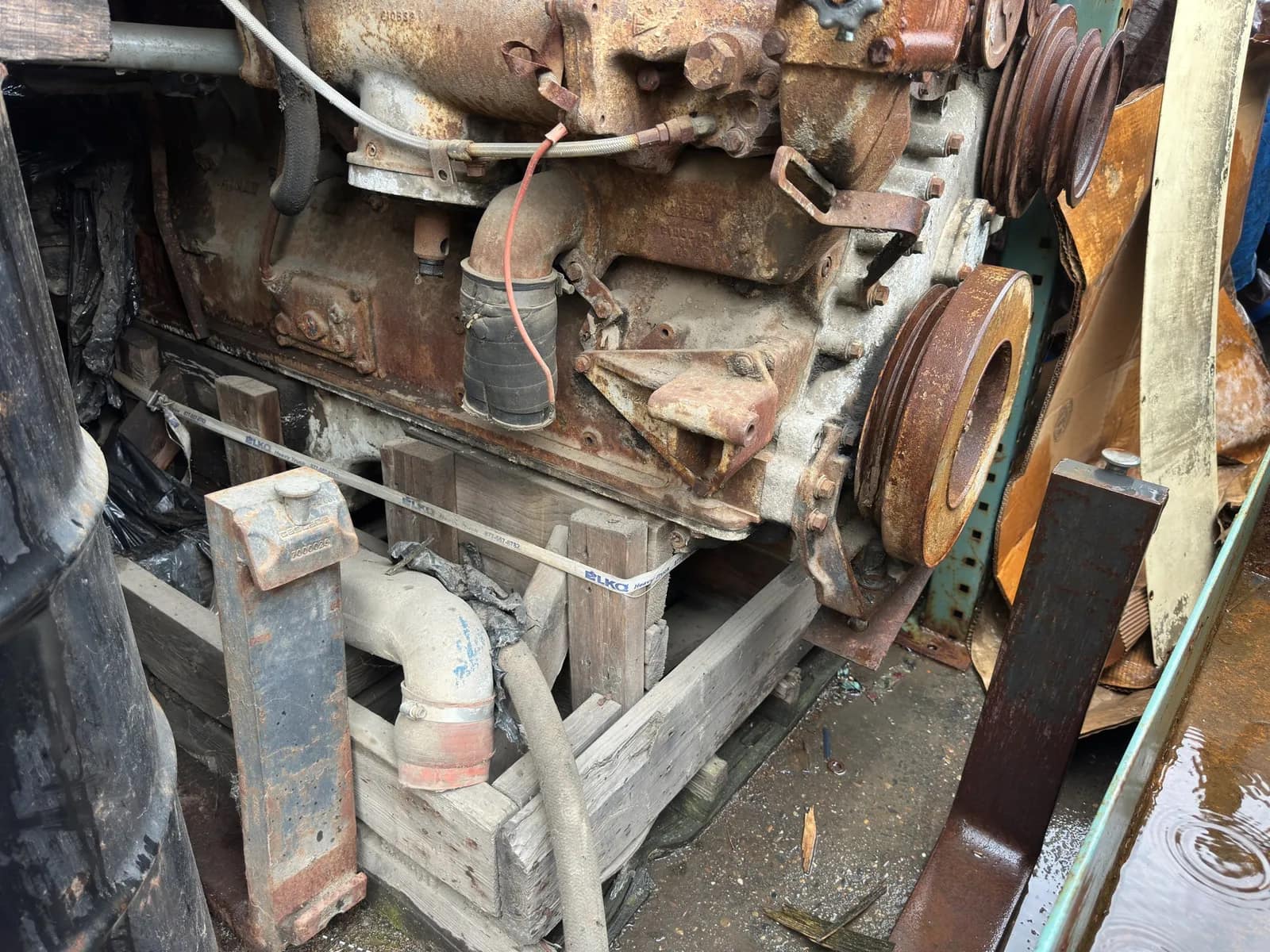 Contents Of Section: Inline 6 Diesel Motor, Tires, And 55 Gallon Barrels, photo 7 of 9