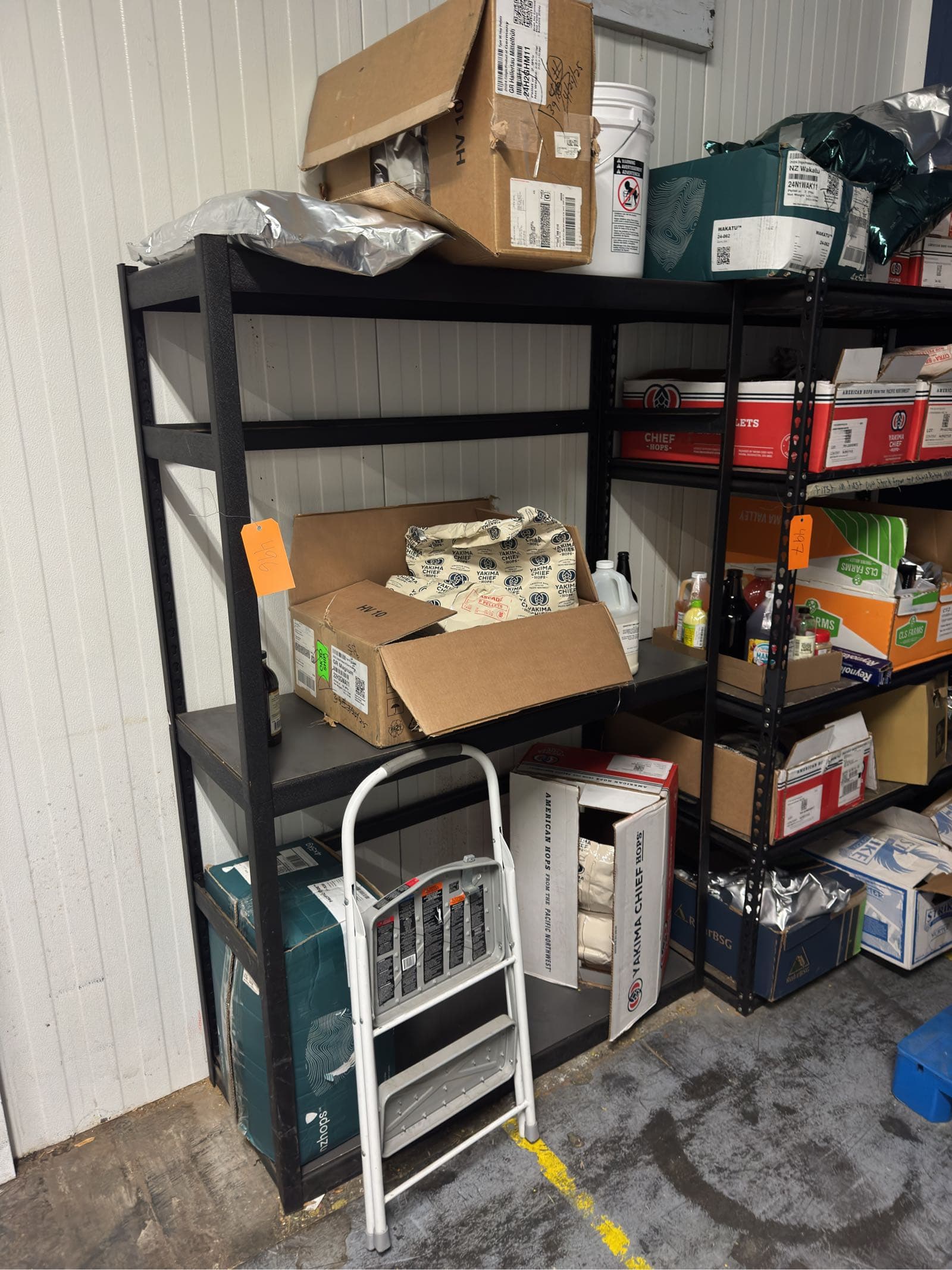 metal-storage-rack-and-contents-step-stool-hops-e5a4ad