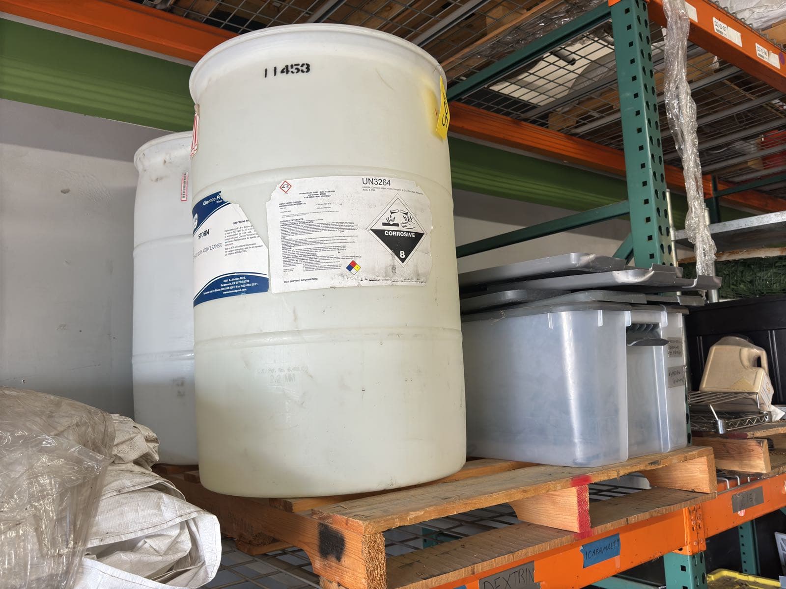 contents-of-pallet-2-empty-55-gallon-drums-and-1-storage-bin-b52efa