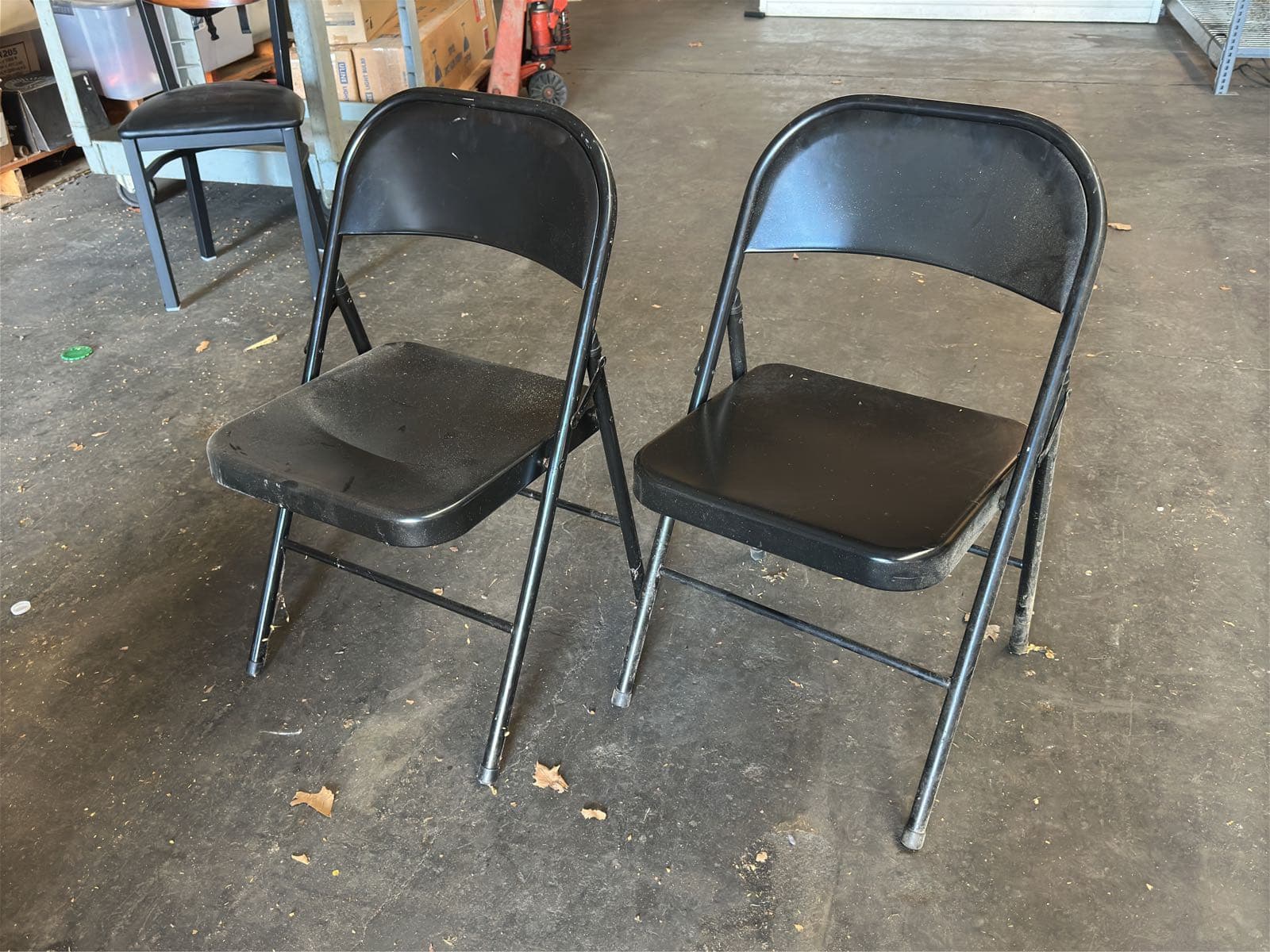 2-black-folding-chairs-5aa034