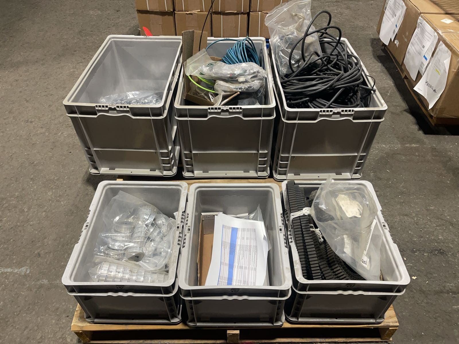 pallet-of-assorted-machine-parts-and-drive-belts-adb665