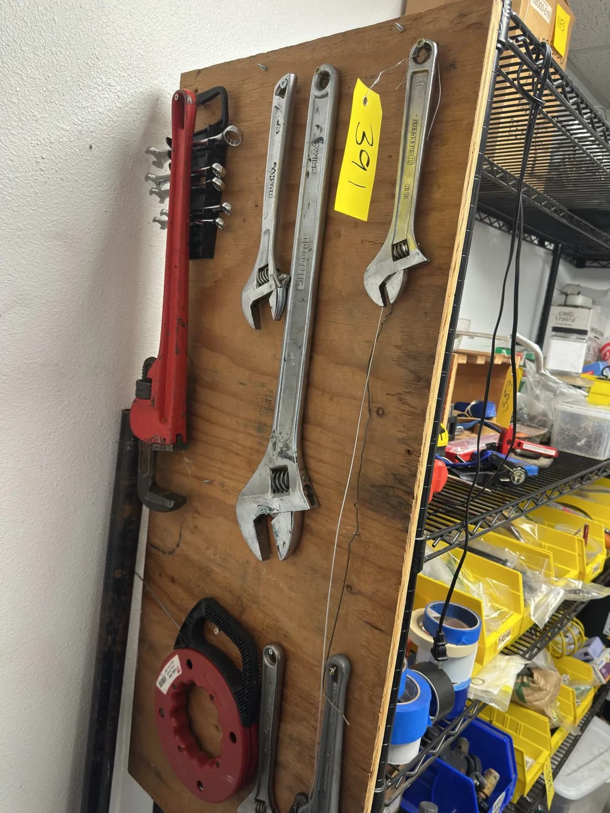 contents-of-wall-heavy-duty-crescent-wrench-pipe-wrench-steel-tape-and-more-715419