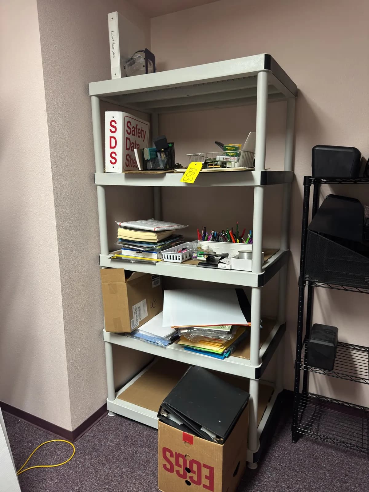 rack-and-contents-office-supplies-paper-pens-glitter-poster-board-and-clip-boards-aaa78e