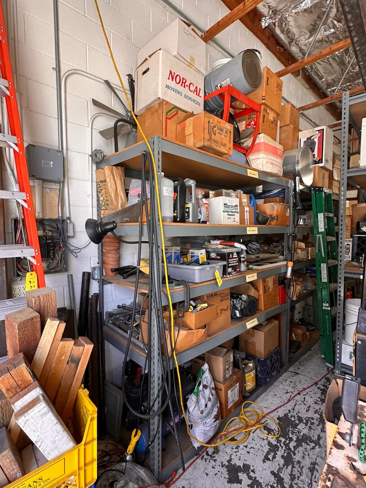 contents-of-shelf-ac-motors-hydraulic-floor-jack-partial-oil-bottles-and-more-969708