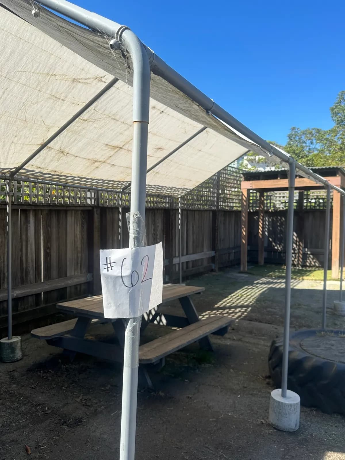 pole-tent-and-picnic-table-d73ccb