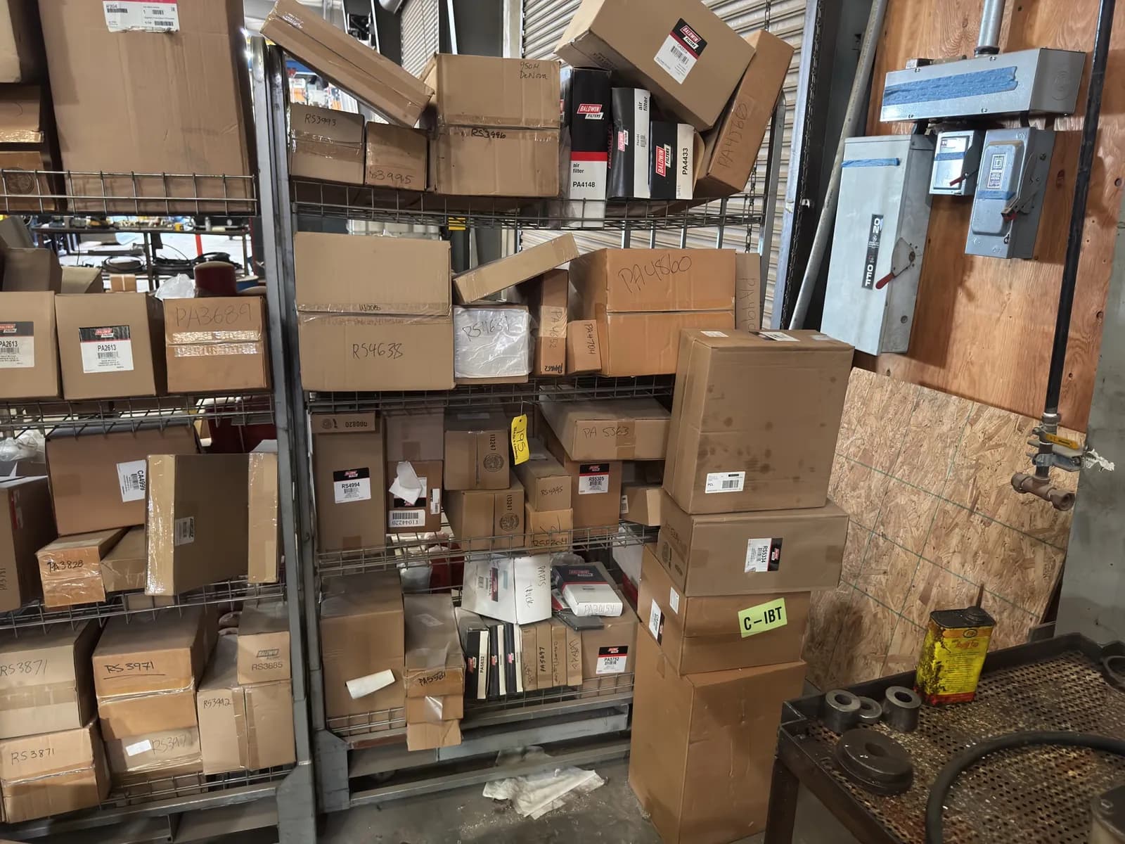 rolling-metal-double-sided-storage-rack-with-contents-assorted-baldwin-and-fleetguard-filters-76d0ad