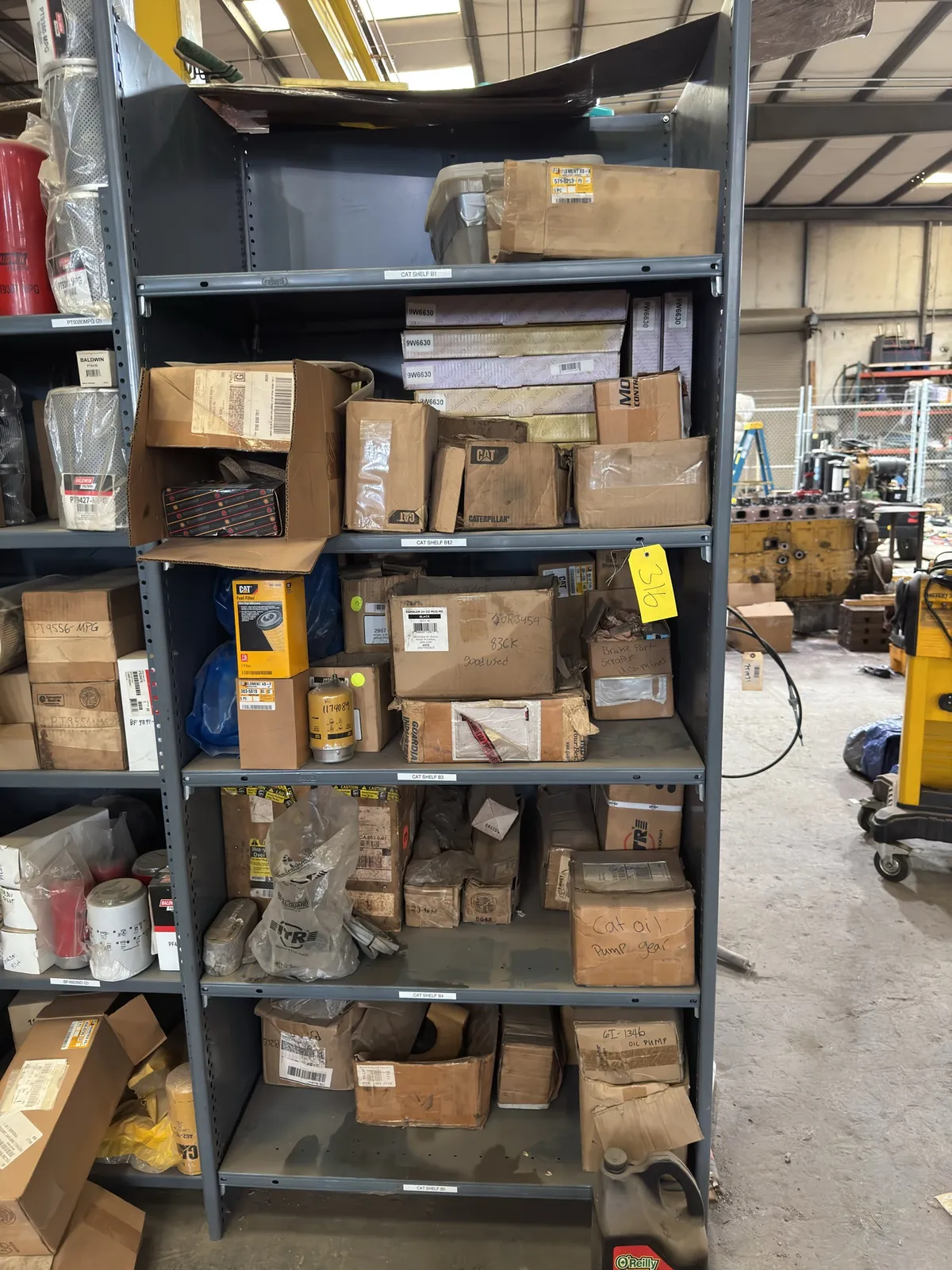 5-tier-metal-shelf-with-contents-assorted-cat-filters-gear-oil-and-more-mo225urb