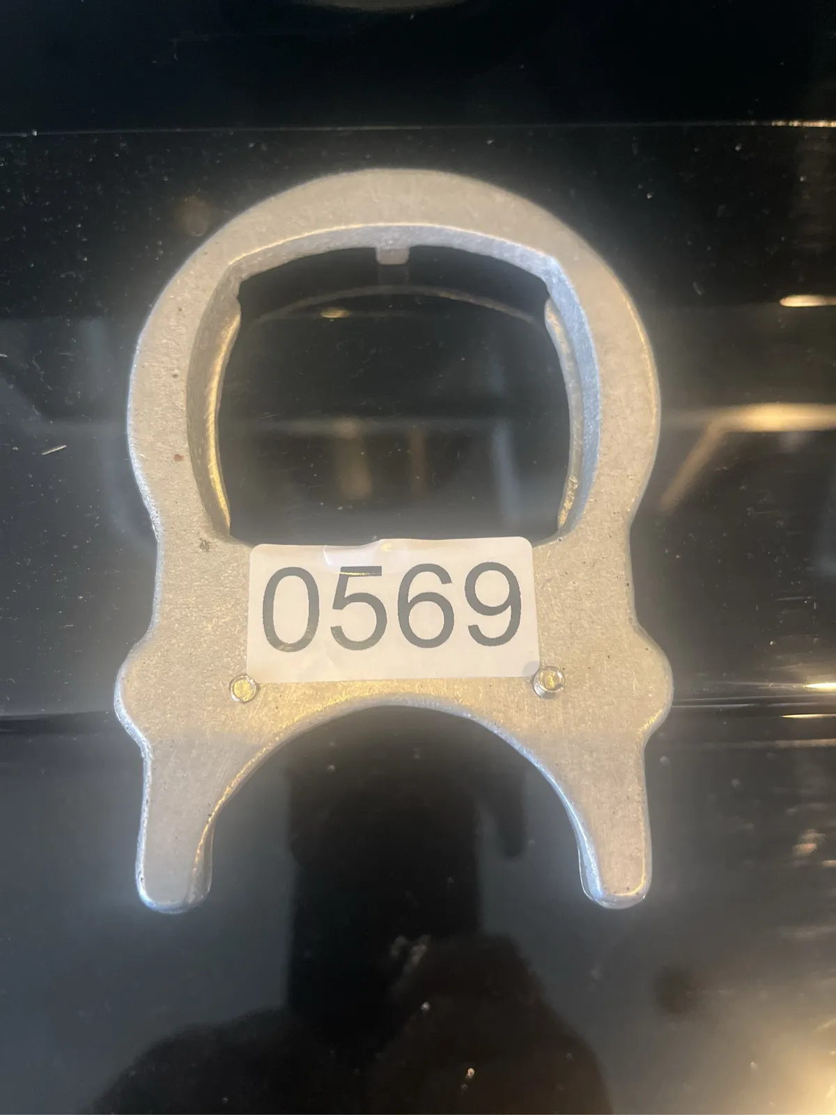 metal-clamp-tool-for-lens-on-projector-with-identification-number-0569-a11e93