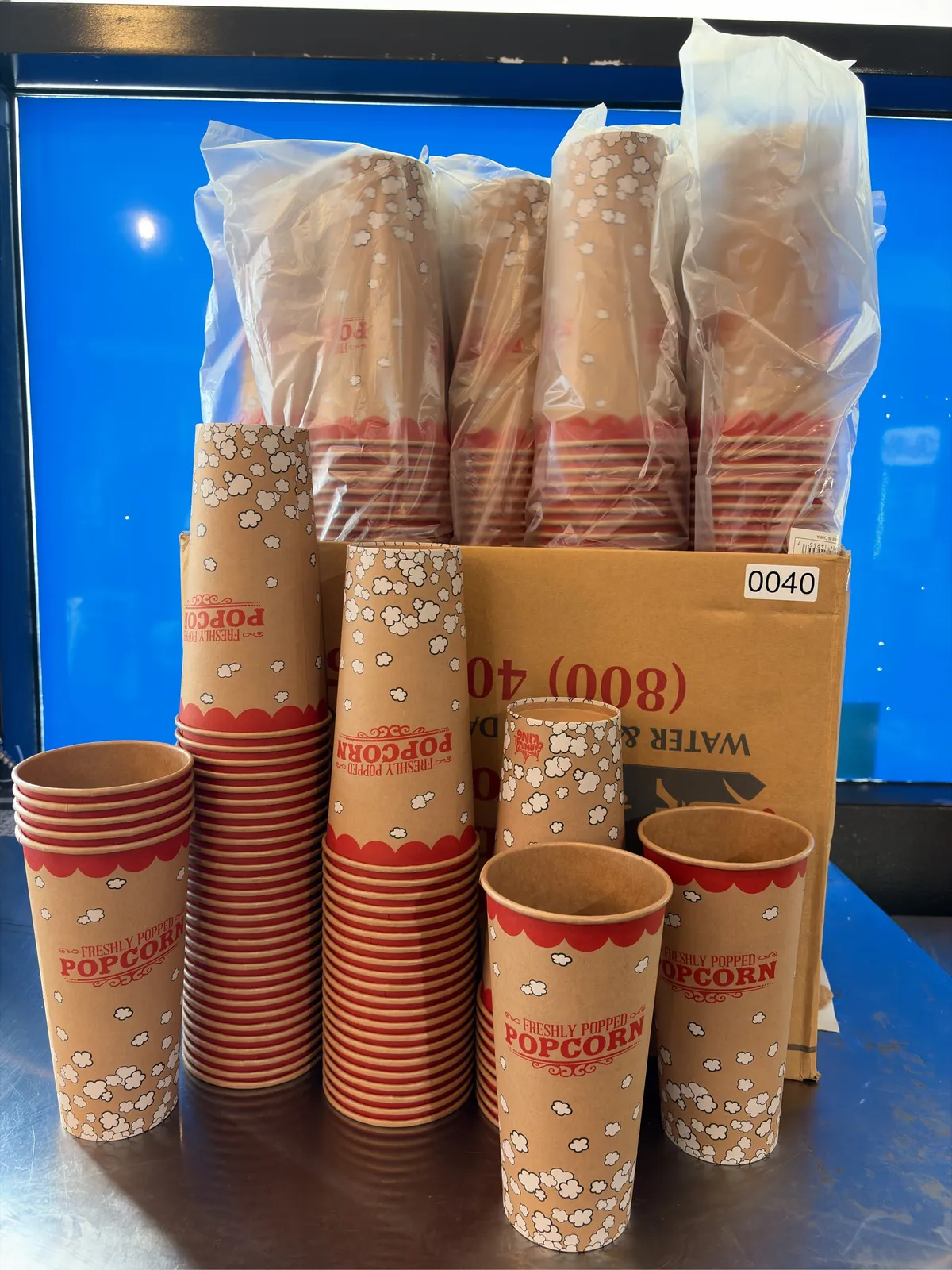 unopened-sleeves-of-24oz-paper-popcorn-tubs-mpq46erc