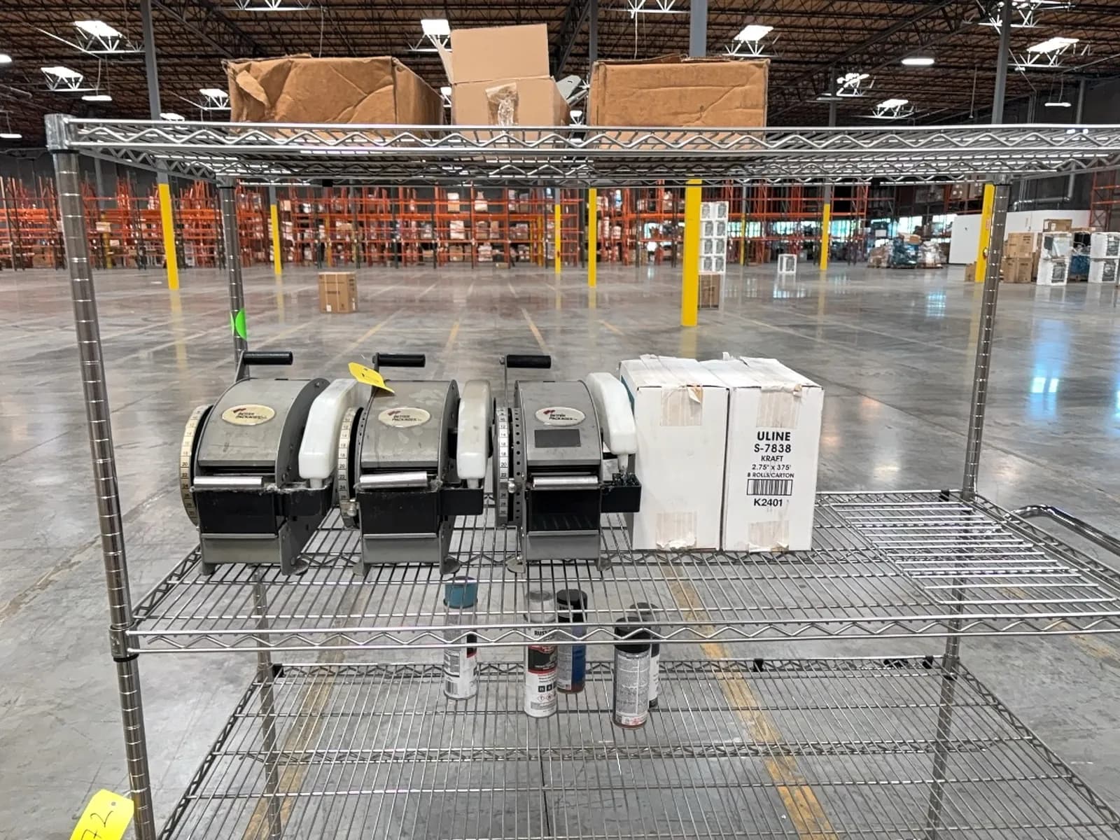 contents-of-rack-3-manual-tape-dispensers-2-boxes-of-tape-assorted-stripping-paint-cans-and-more-1126d2