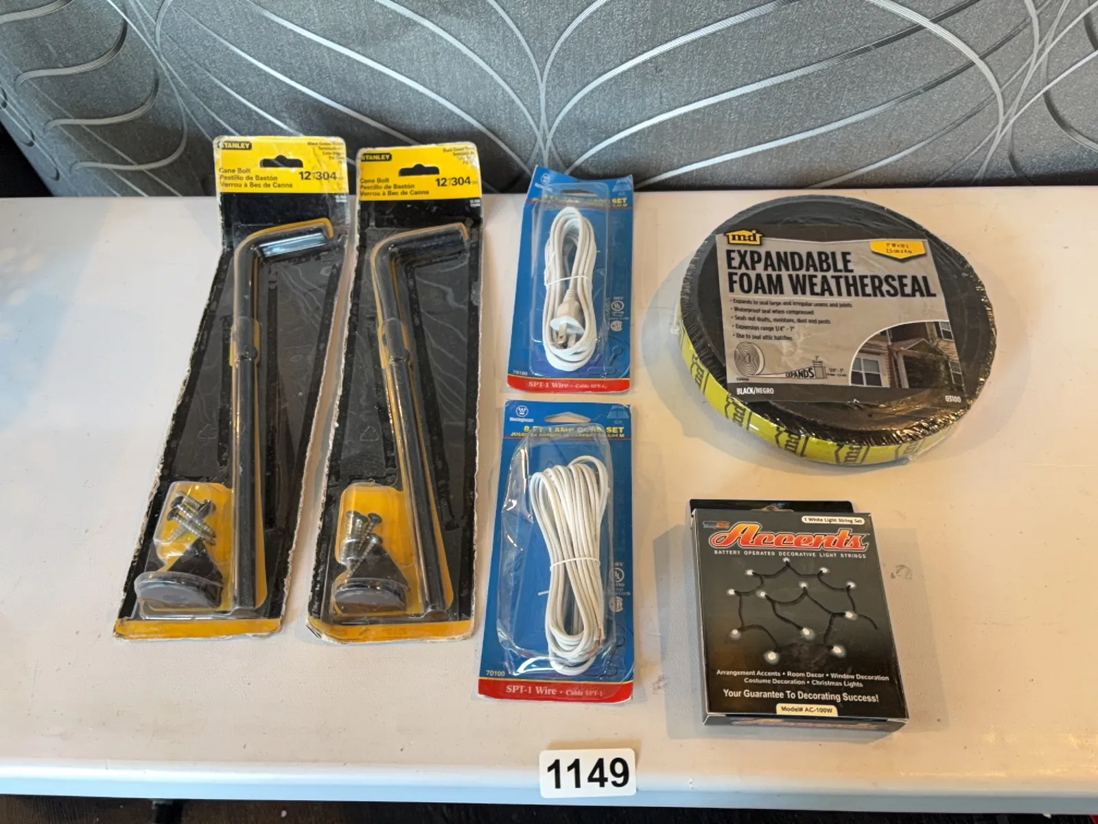 assorted-new-in-box-items-2-cane-bolts-2-8-lamp-cord-sets-expandable-foam-weatherseal-battery-operated-lights-mqllfxx6