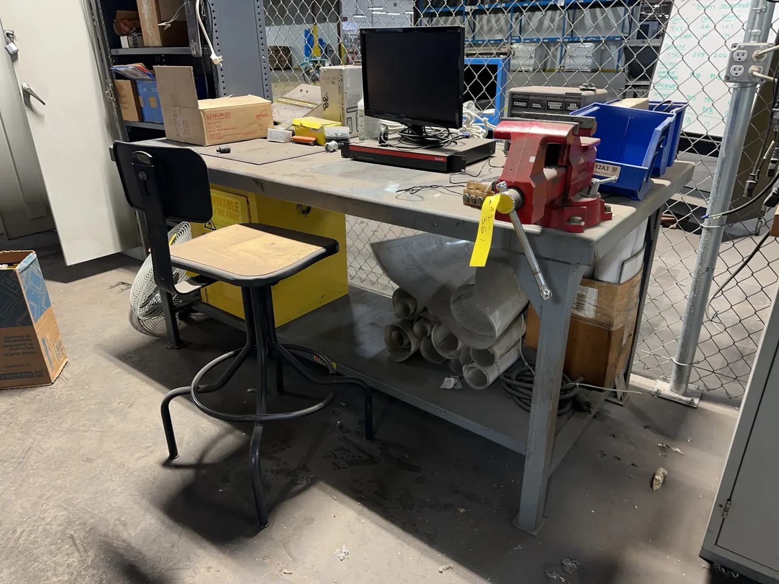 metal-table-with-mounted-bench-vise-and-contents-included-fire-cabinet-not-included-mrmj1wy3