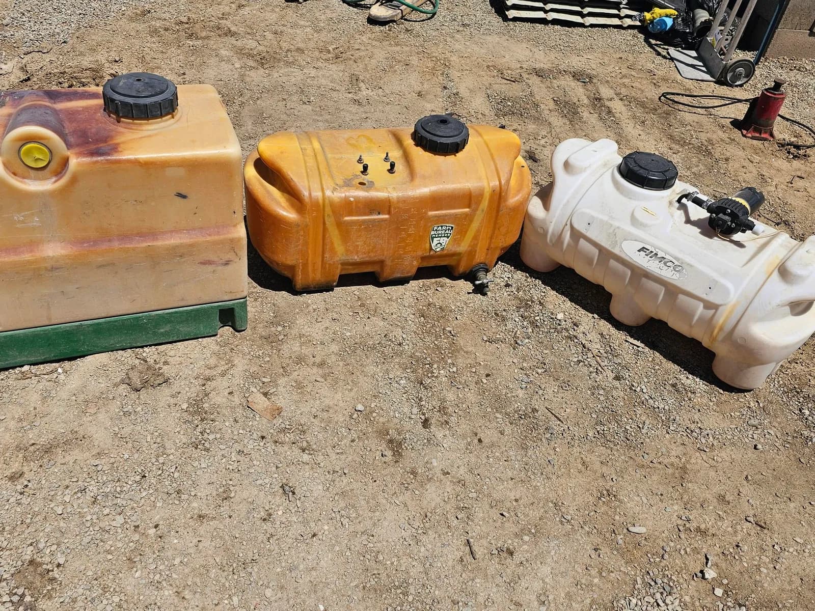 3-plastic-liquid-storage-tanks-in-various-colors-mrxy5j5a