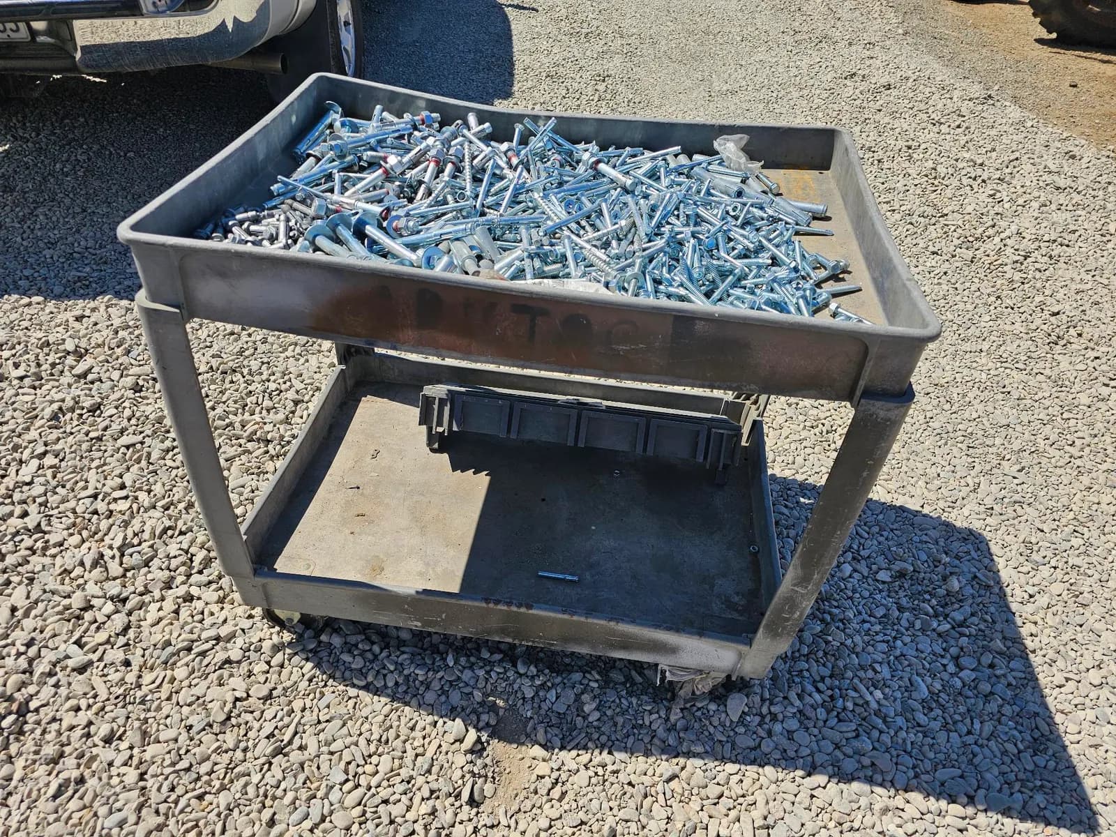 metal-utility-cart-loaded-with-assorted-screws-0670c9