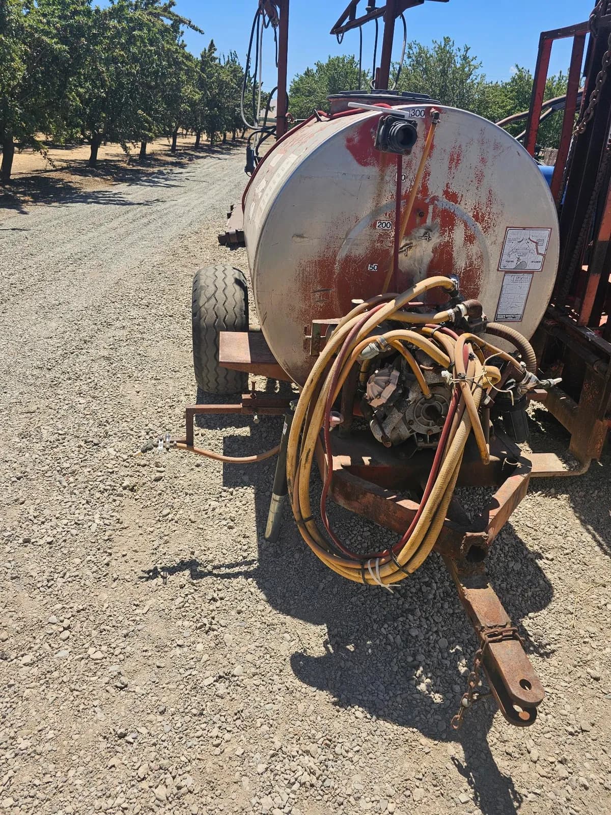 used-agricultural-spray-tank-with-hose-and-trailer-attachment-2e83a9