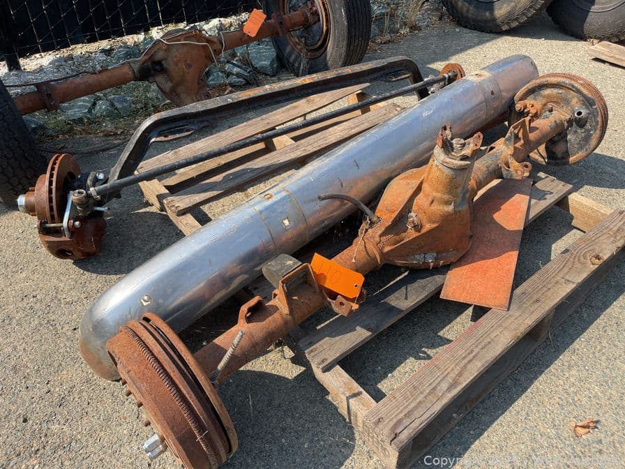 contents-of-pallet-1955-59-front-drop-axle-with-disc-brakes-12-bolt-rear-axle-and-front-bumper-607272