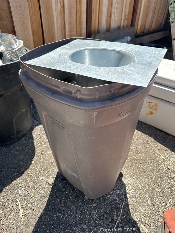 rolling-trash-can-and-contents-metal-flashing-593469