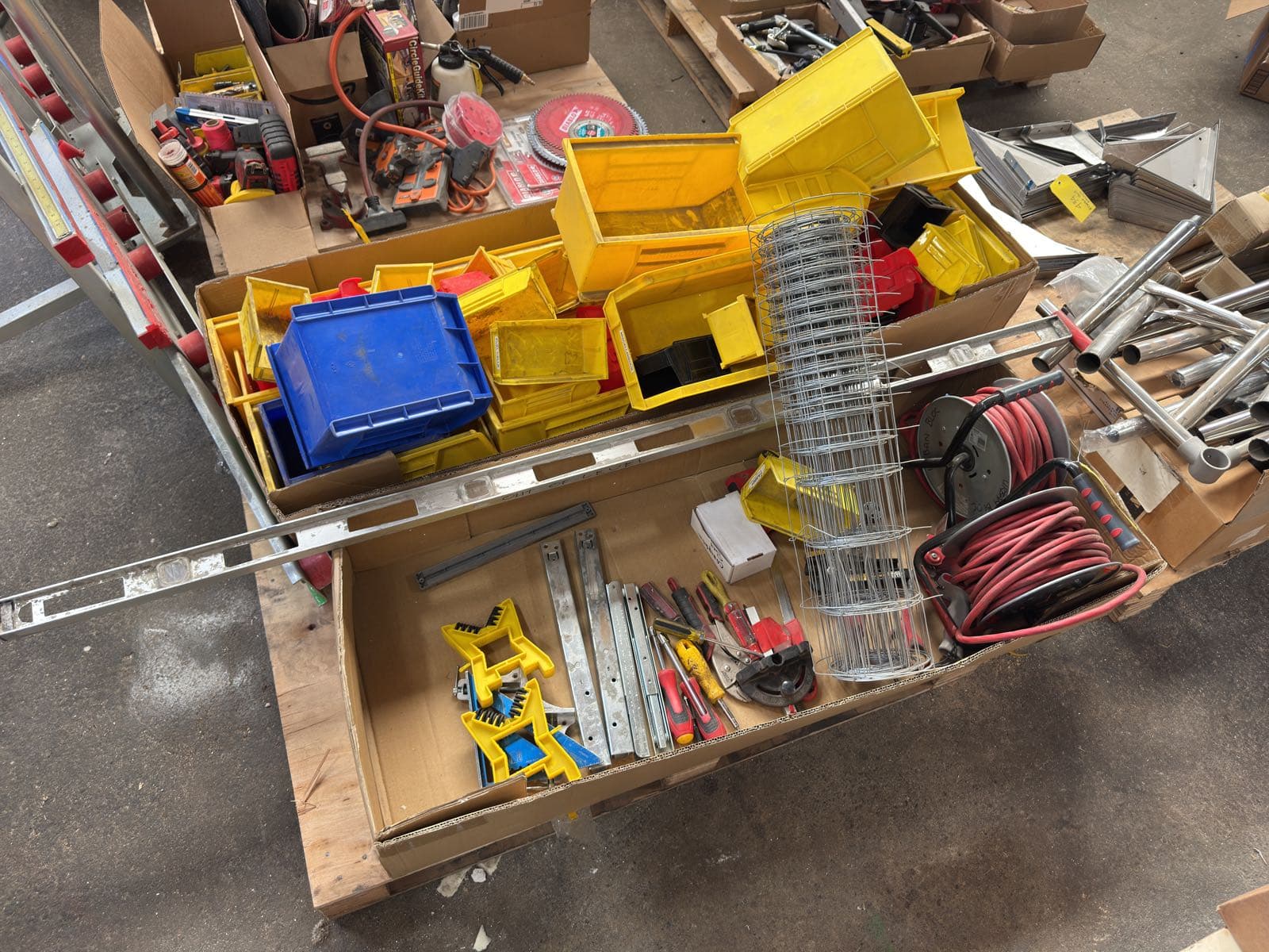 contents-of-pallet-organizer-bins-2-power-extension-reels-chicken-wire-screwdrivers-and-vice-grips-ml1ef6z6