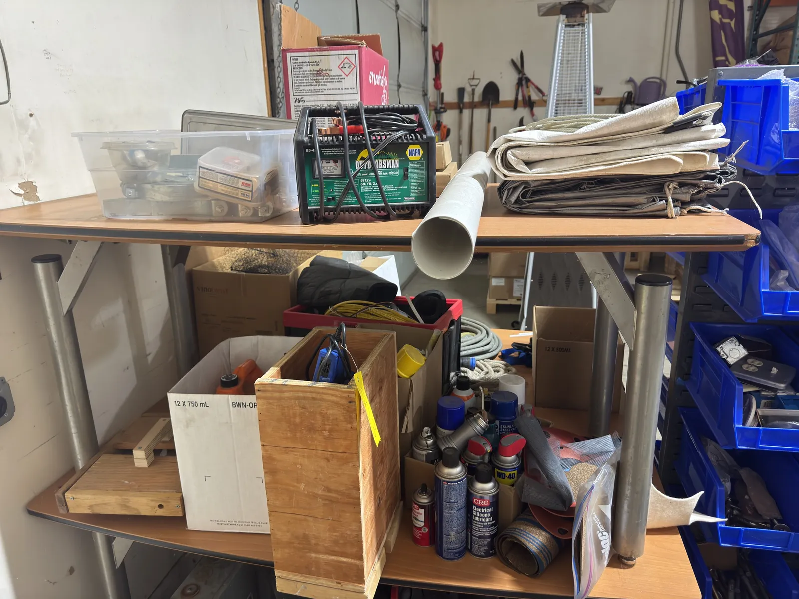 contents-of-shelves-lubricants-glue-guns-tarps-and-battery-tender-72bc3d