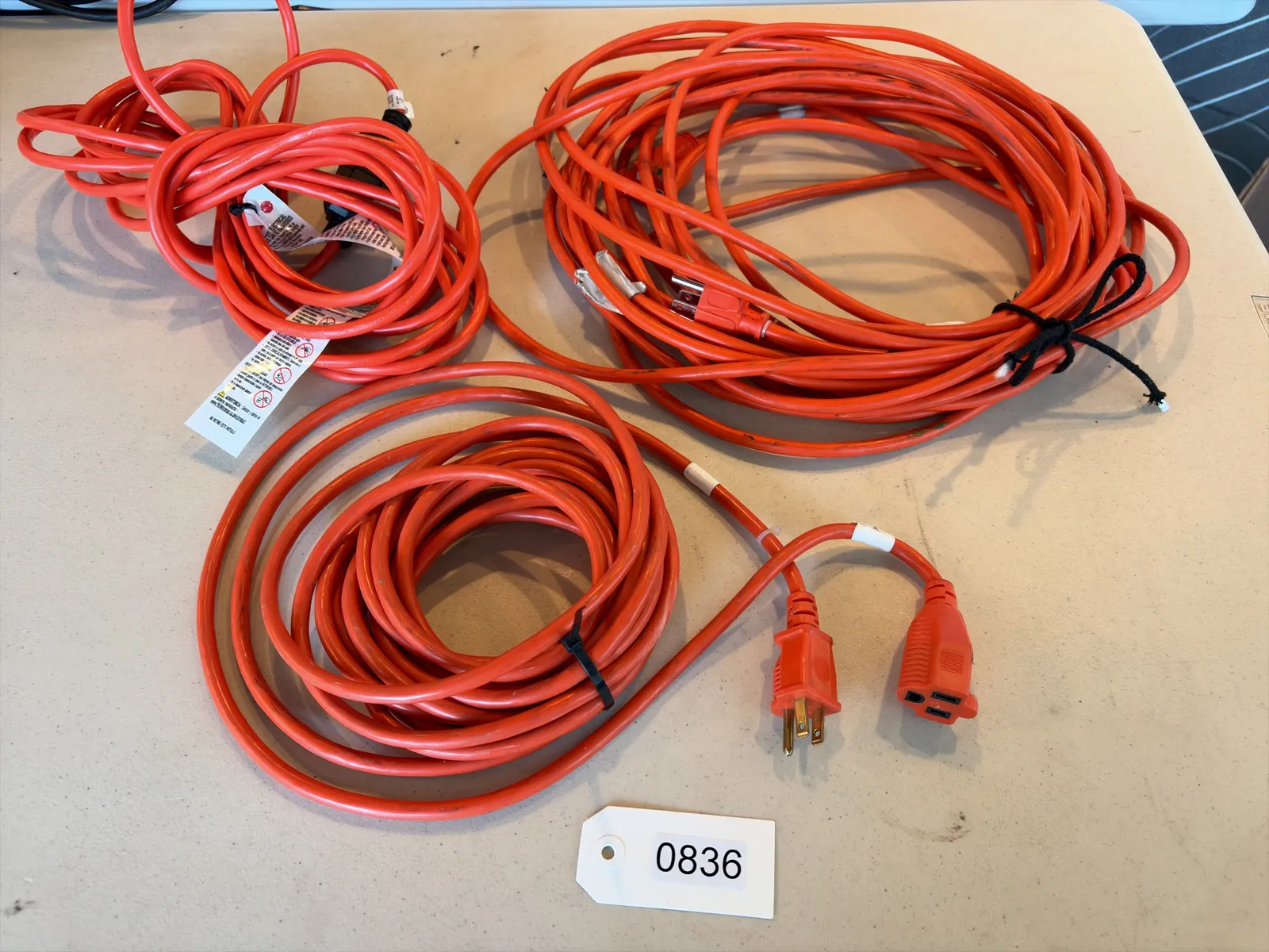 3-orange-light-duty-extension-cords-1-50-2-25-mpr7o9ju